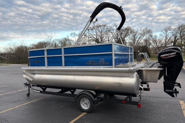 2026 Sun Tracker Party Barge 16 DLX pontoon boat with Mercury outboard motor.