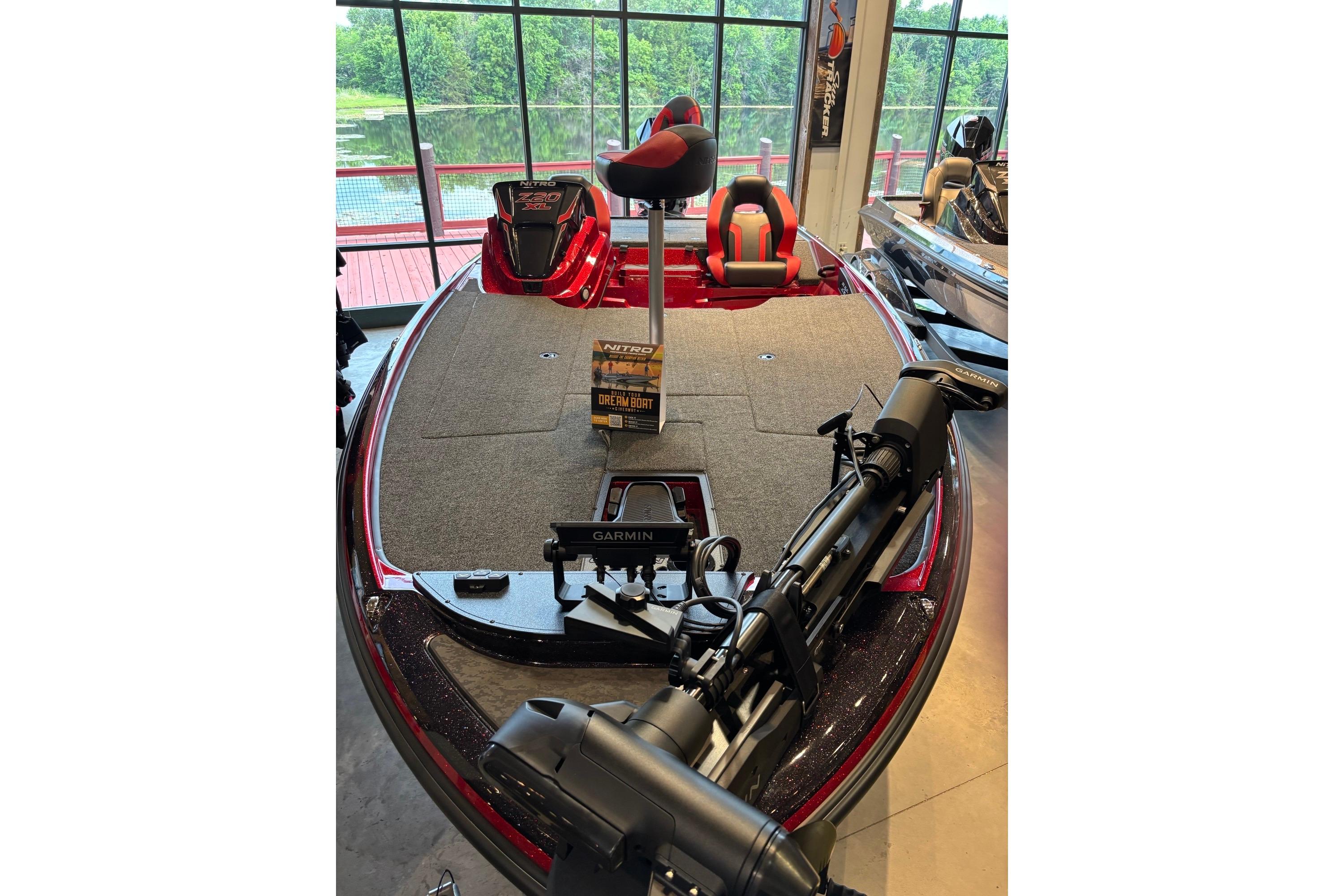 2026 Nitro Z20 XL Pro boat with Garmin equipment, displayed indoors near large windows.