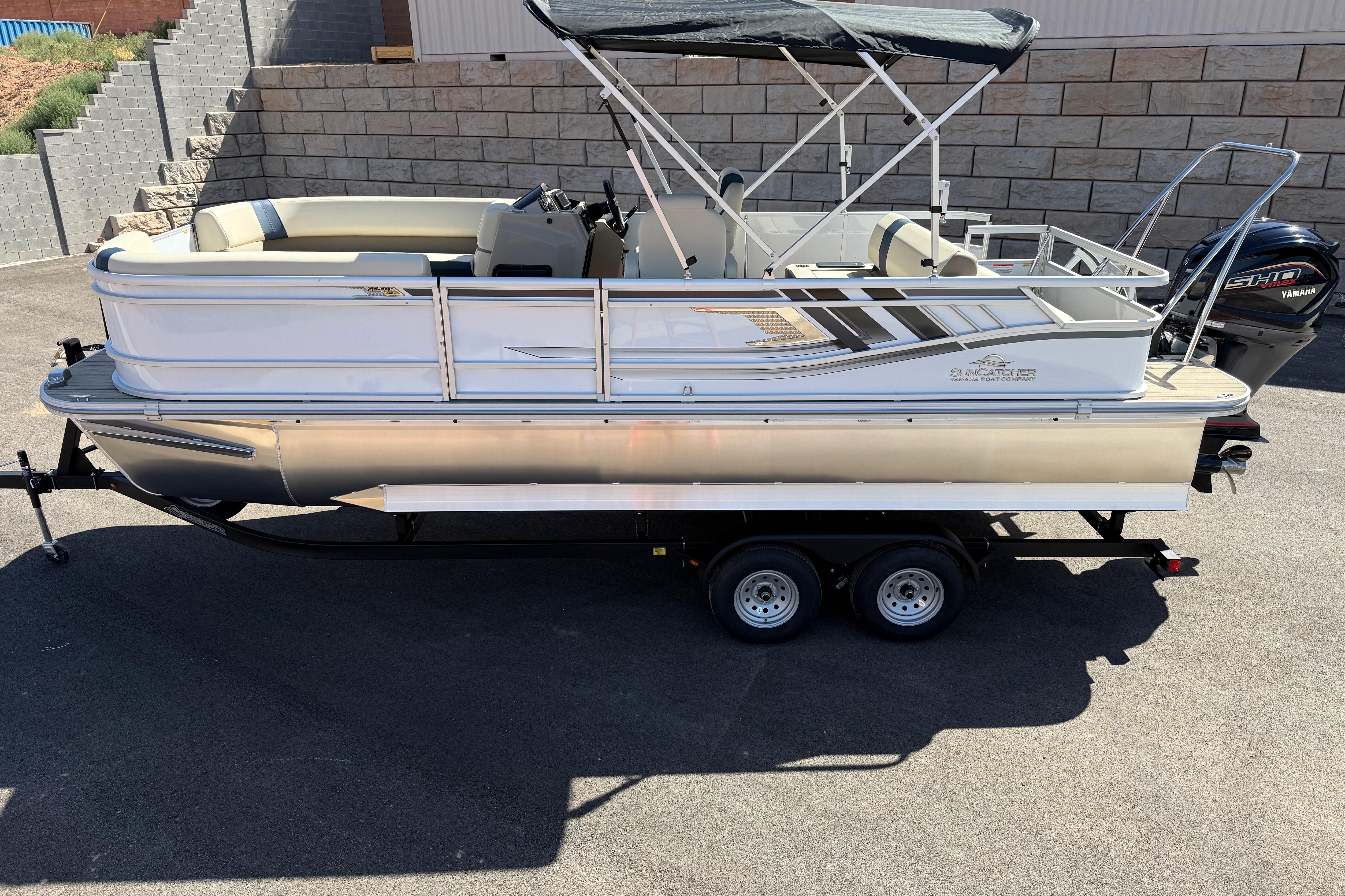2026 SunCatcher Select 322SL pontoon boat on trailer, featuring Yamaha outboard motor.