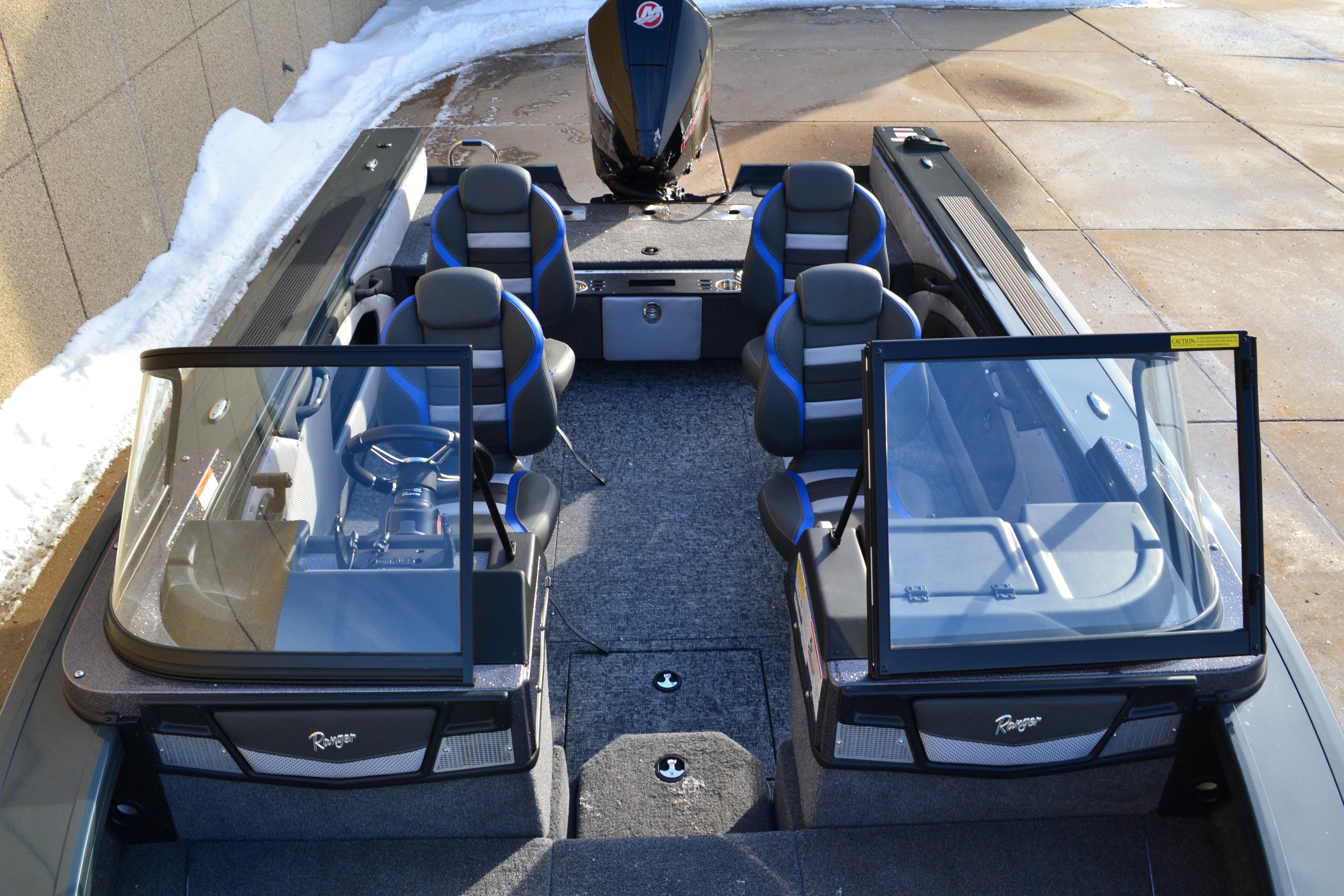 2026 Ranger VX1888 WT boat interior with seating and steering wheel, parked on snowy pavement.