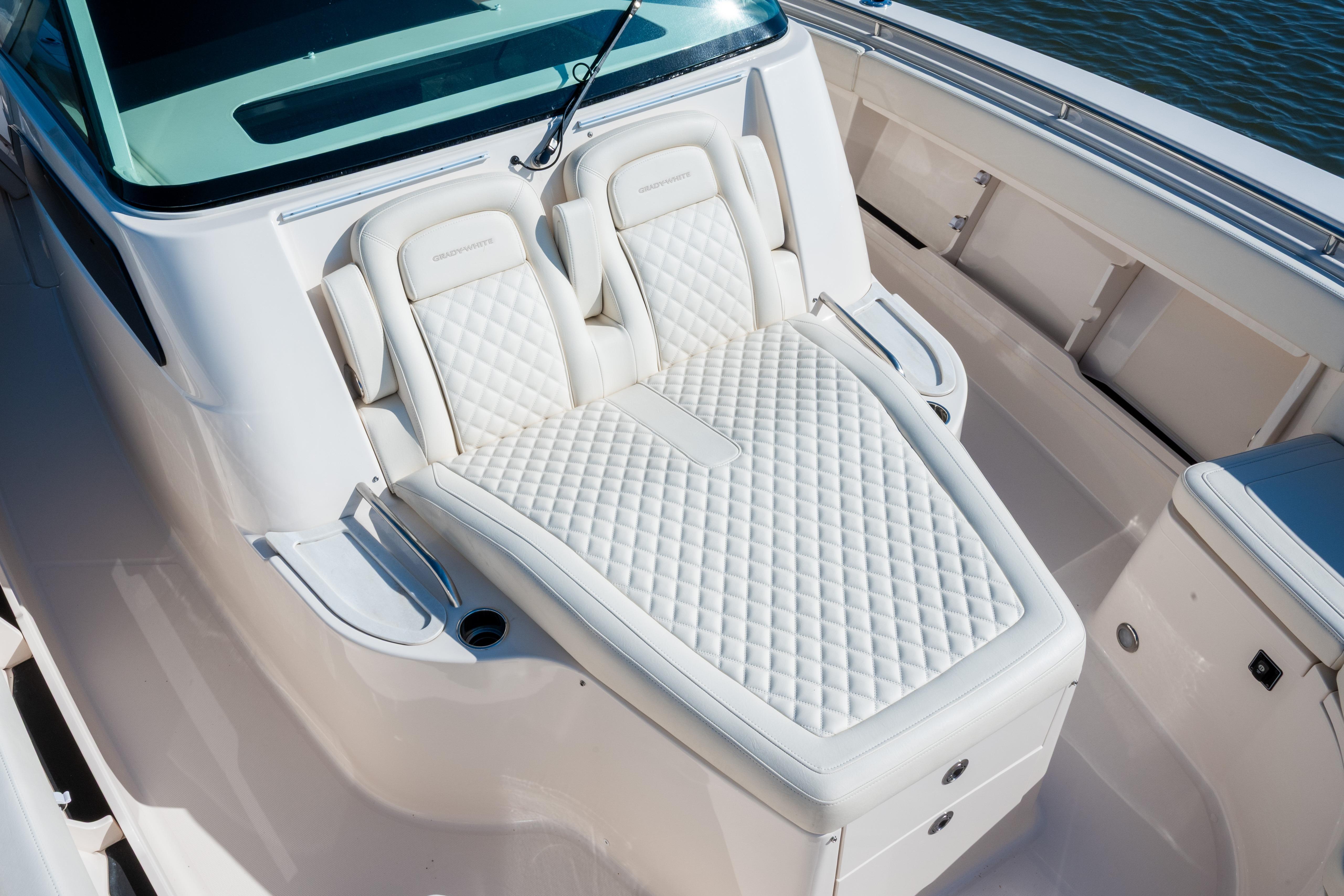 Luxurious seating on the 2025 Grady-White Canyon 386 boat, featuring elegant white upholstery.