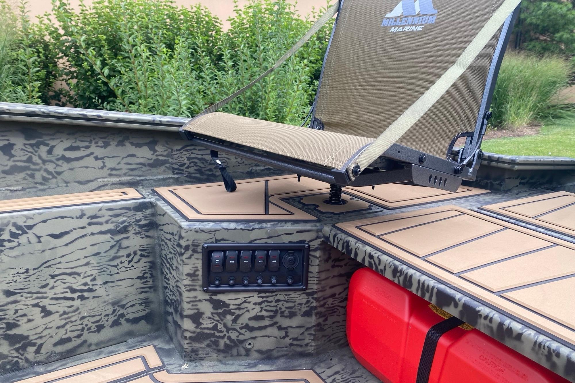 2026 Tracker Grizzly 1650 T Prairie Wings Edition boat interior with camo design and seating.