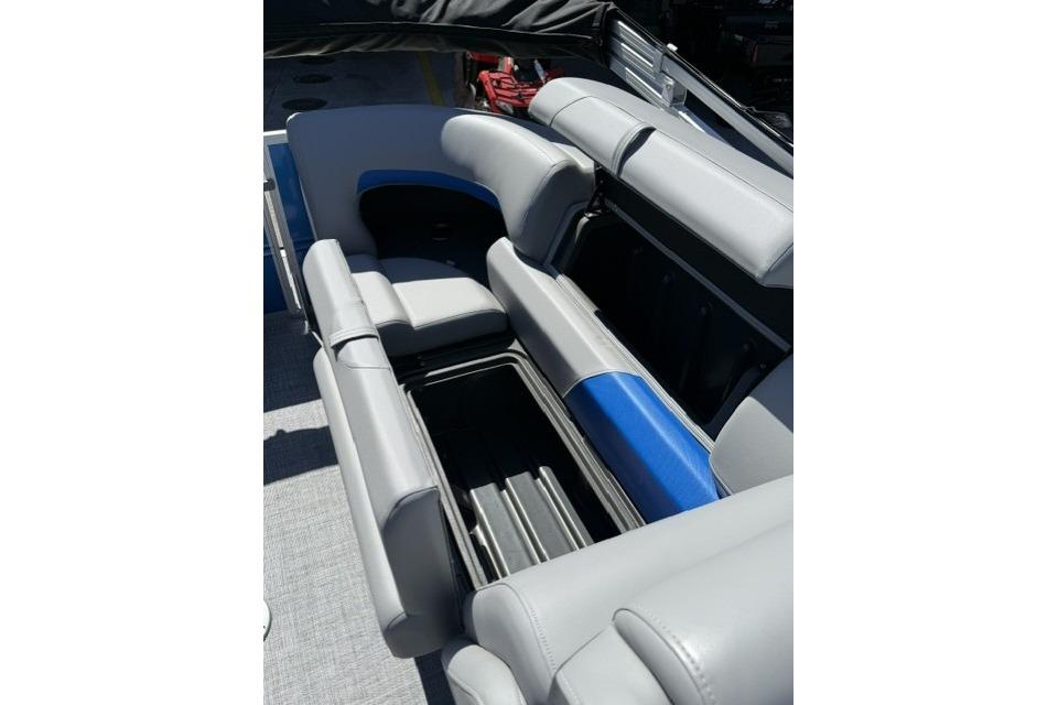 2026 Sun Tracker Party Barge 24 XP3 interior seating with storage compartments.