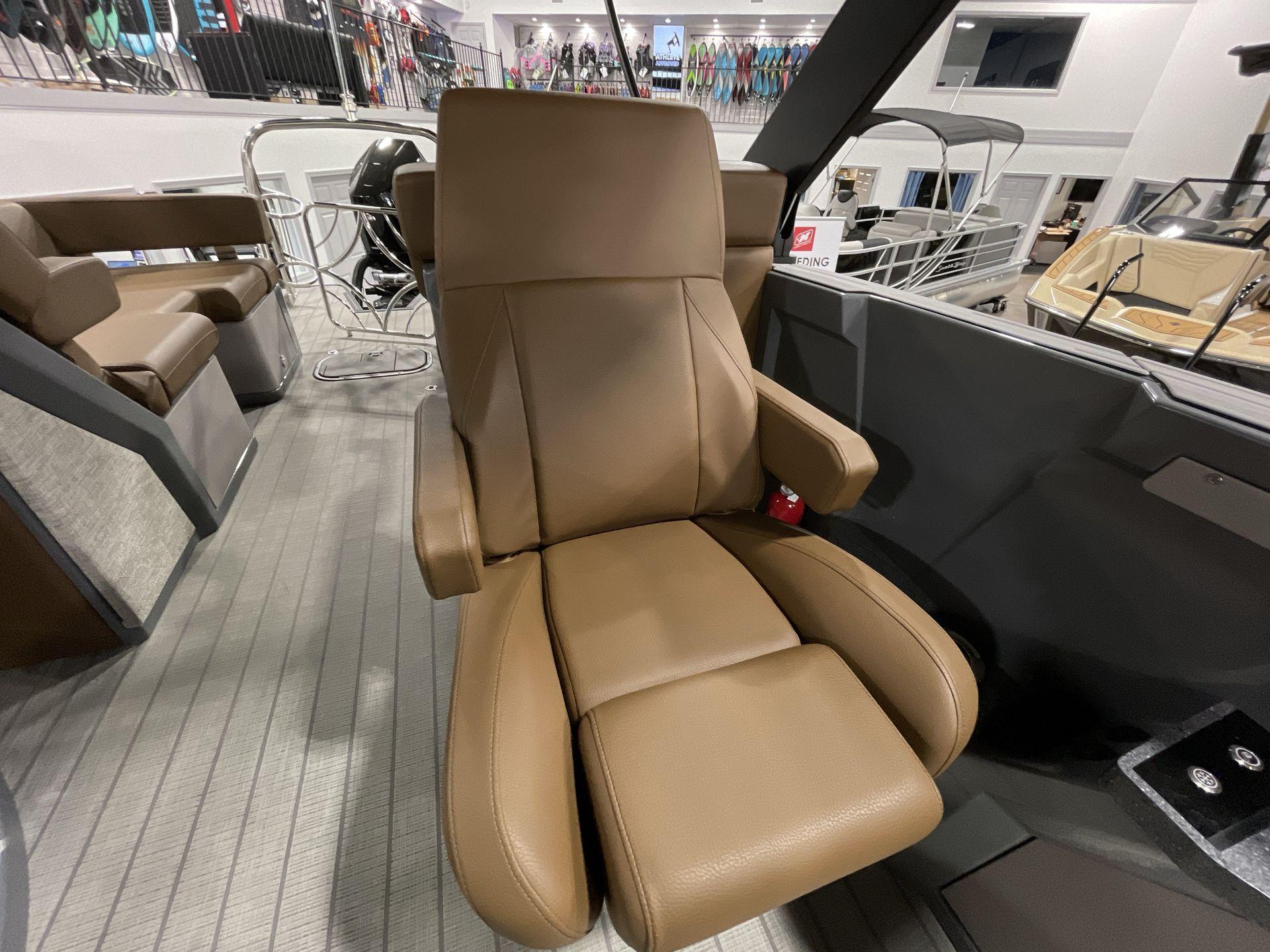 Luxurious brown captain's chair in 2025 Balise Horizon 26C boat interior.