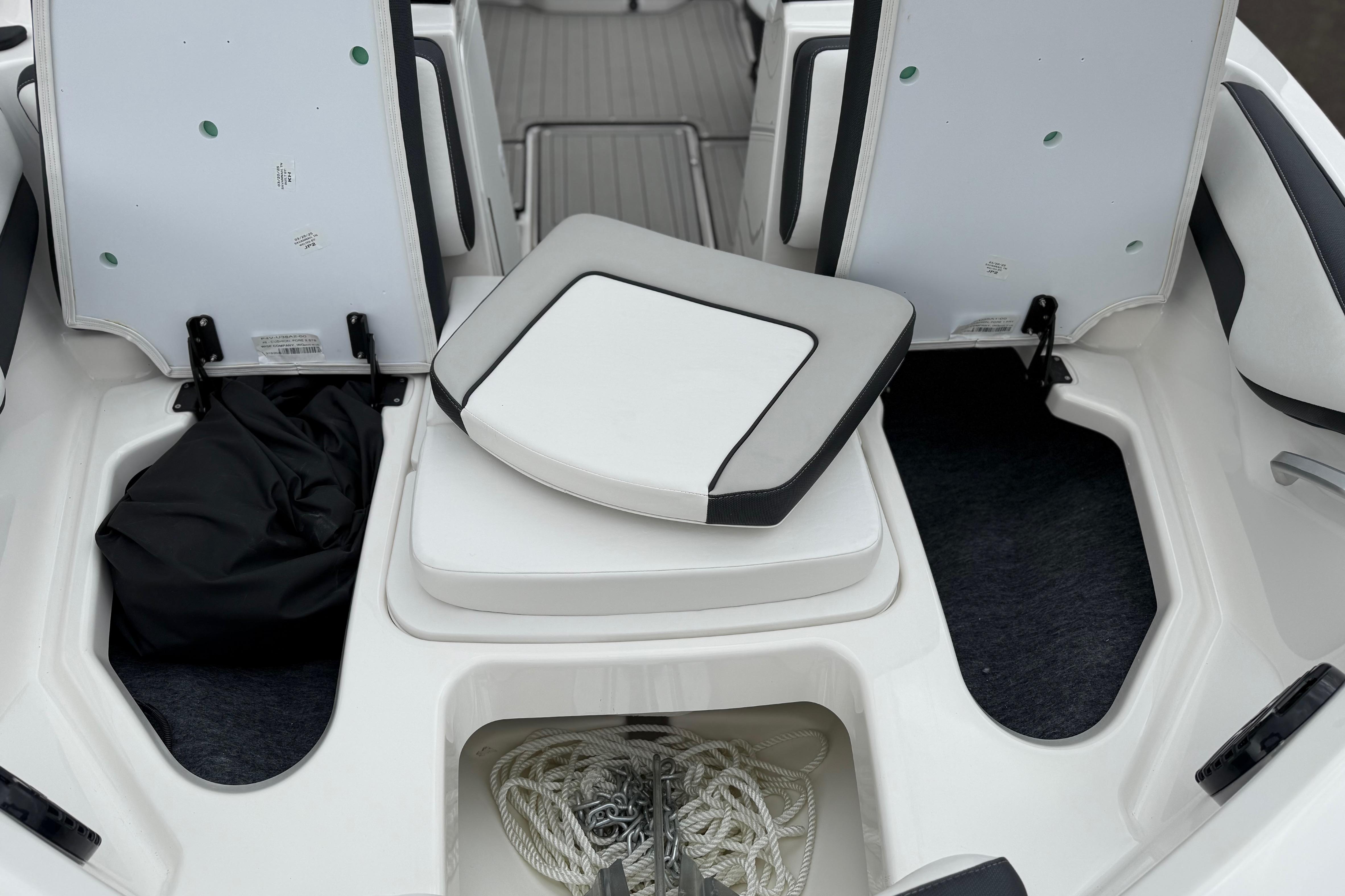 2025 Yamaha Boats 195S interior with open storage compartments and seating.
