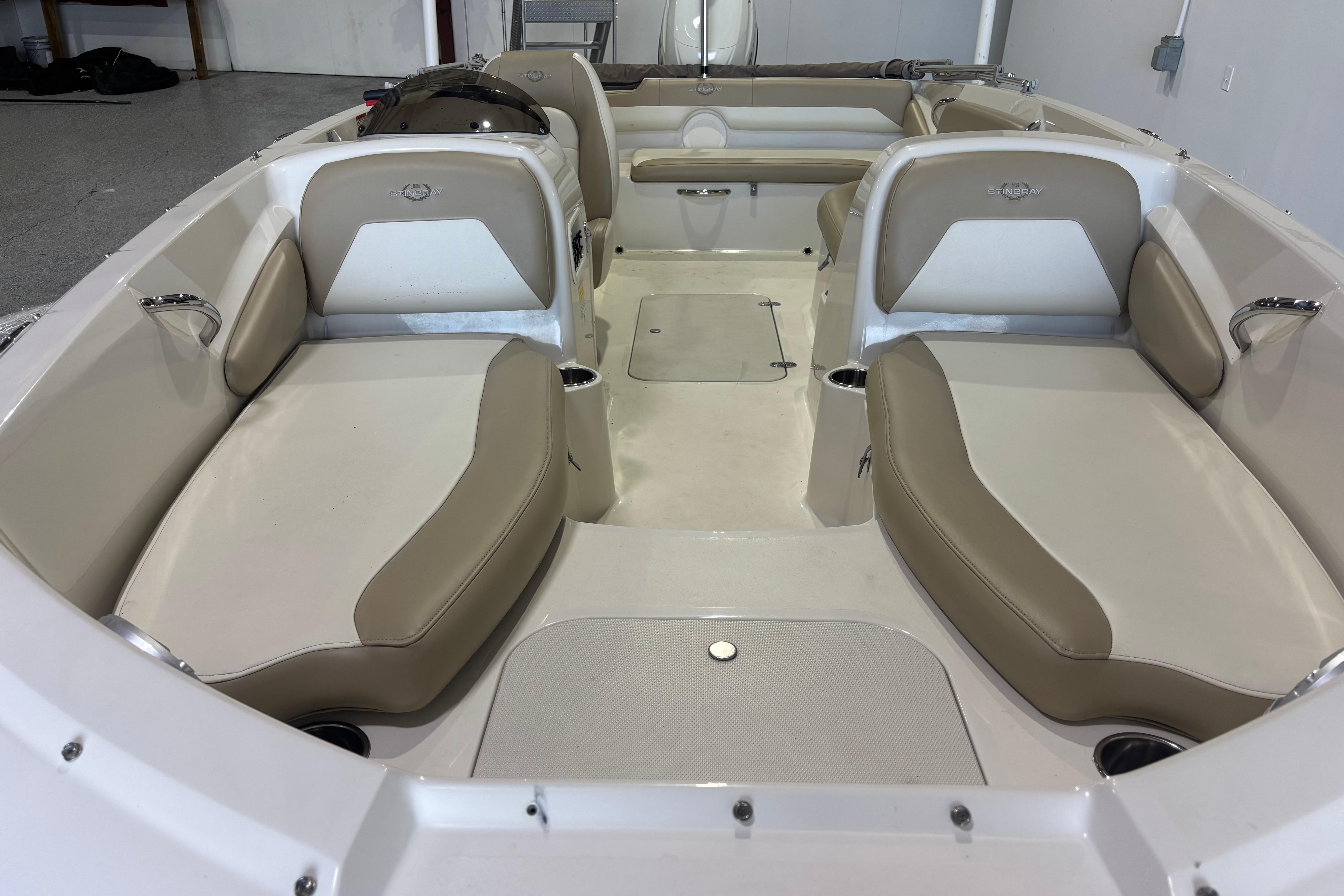 2017 Stingray 182 SC boat interior with beige seating and spacious layout.