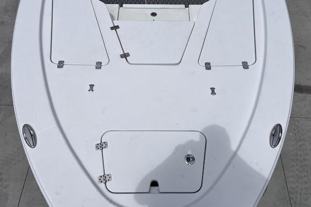 2021 Sportsman Tournament 234 SBX Bay Boat deck, featuring storage compartments and sleek design.
