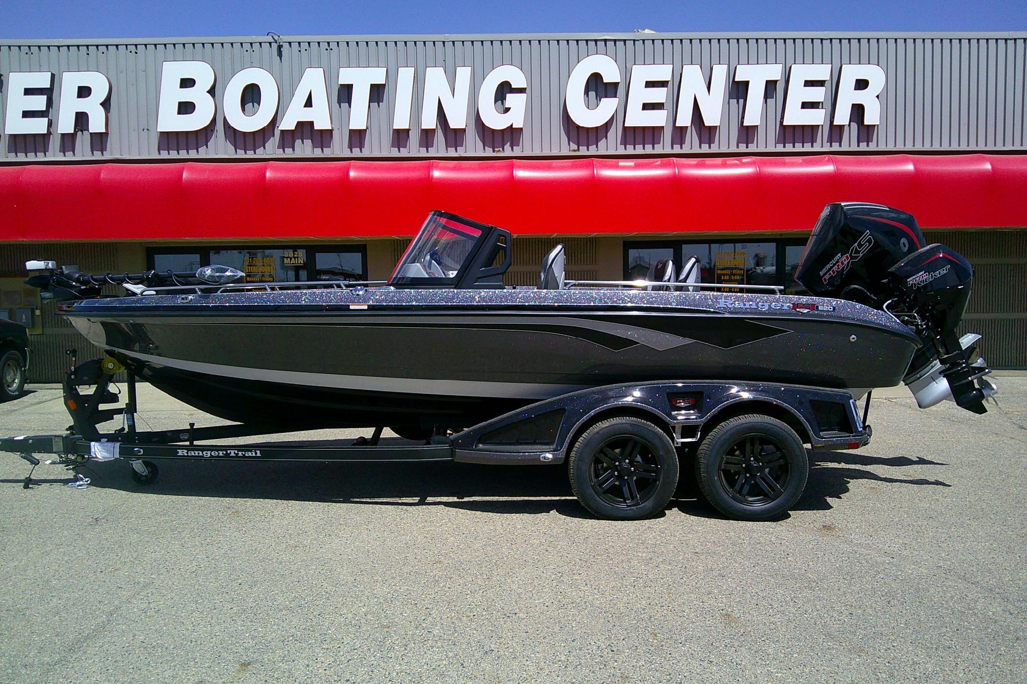 2026 Ranger 620FS Cup-Equipped boat on trailer outside boating center.