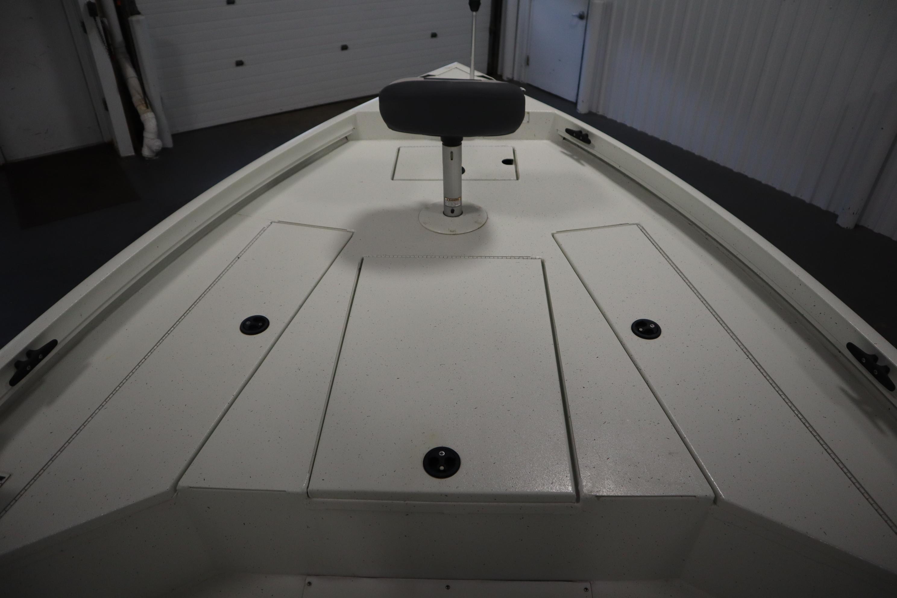 2022 Crestliner 2200 CC boat deck with storage compartments and seat.
