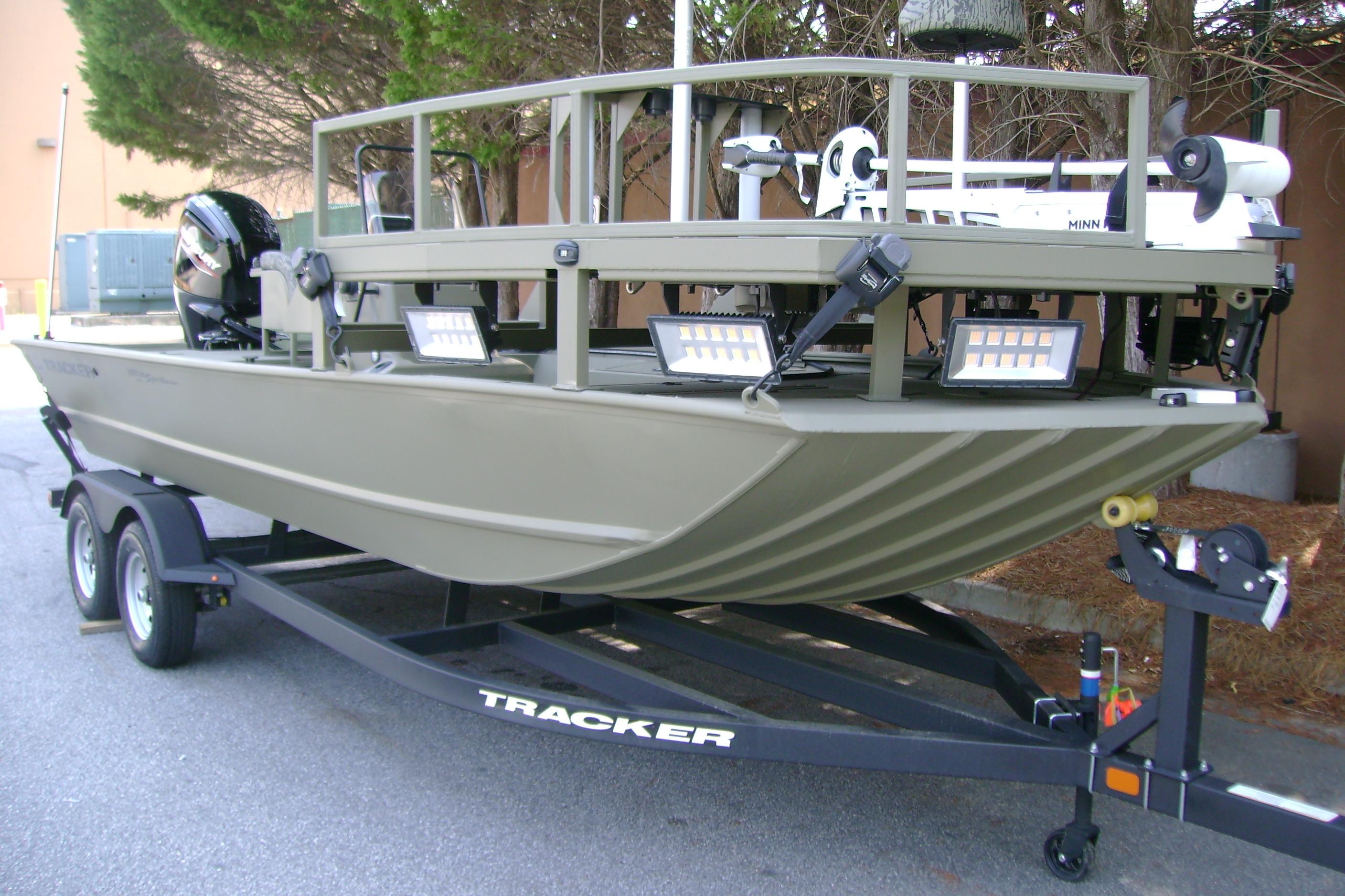 2026 Tracker Grizzly 2072 CC Sportsman boat on trailer, featuring advanced lighting and equipment.