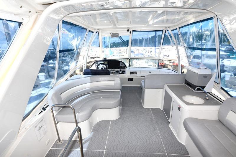 2008 Carver 43 Super Sport yacht interior with spacious seating and modern helm.