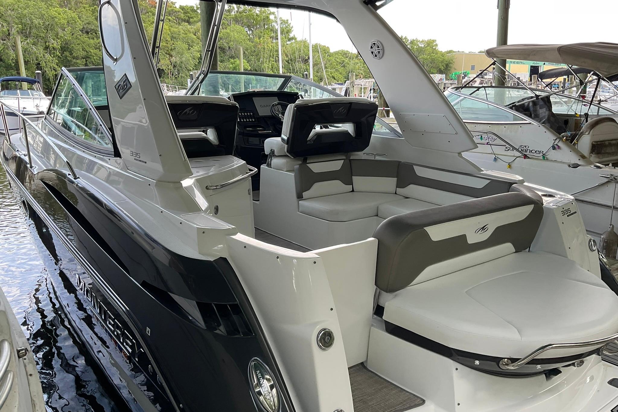 2019 Monterey 335 Sport Yacht with sleek design and spacious seating area.