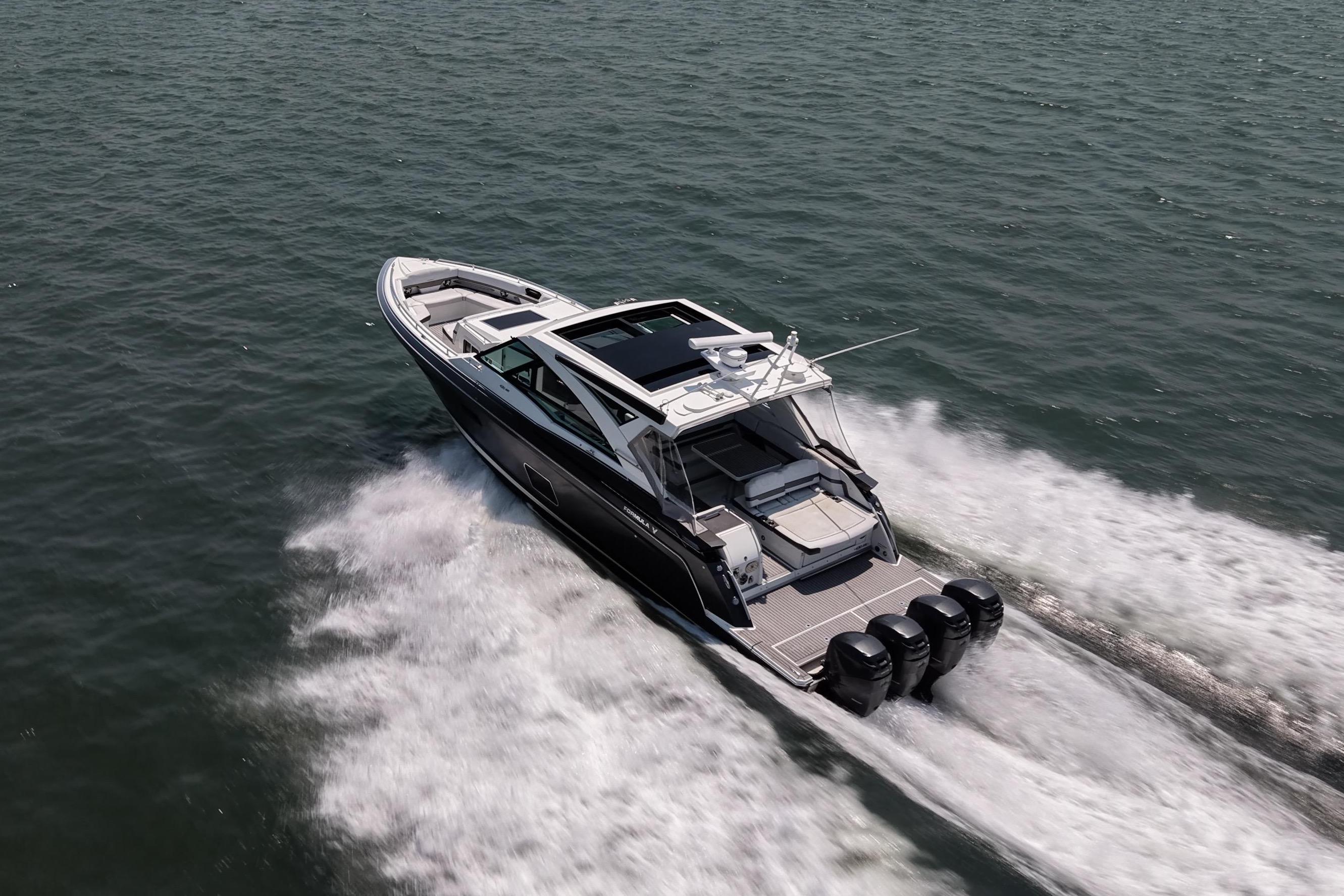 2019 Formula 430 Super Sport Crossover speeding on open water, showcasing sleek design and powerful engines.