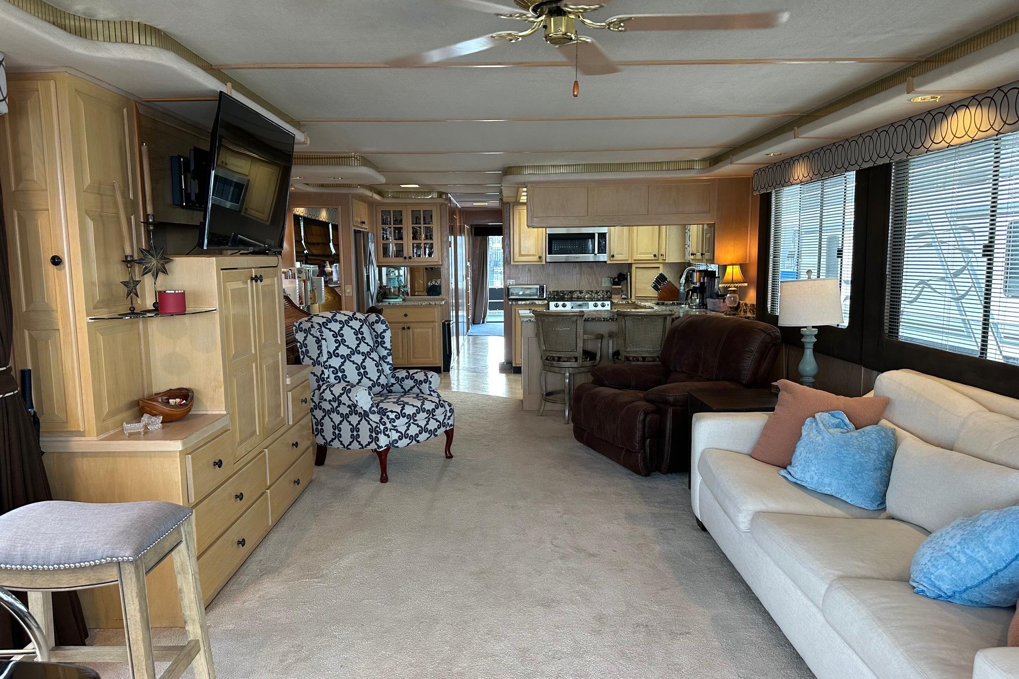 Luxurious interior of a 1995 Stardust Cruisers 16x75 houseboat with modern furnishings.