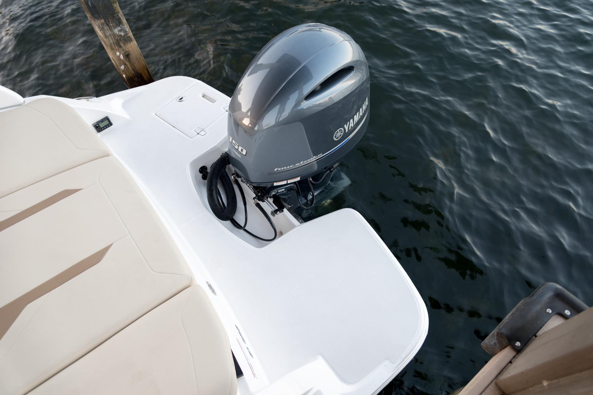 2026 Regal 21 OBX boat with Yamaha outboard motor on water.