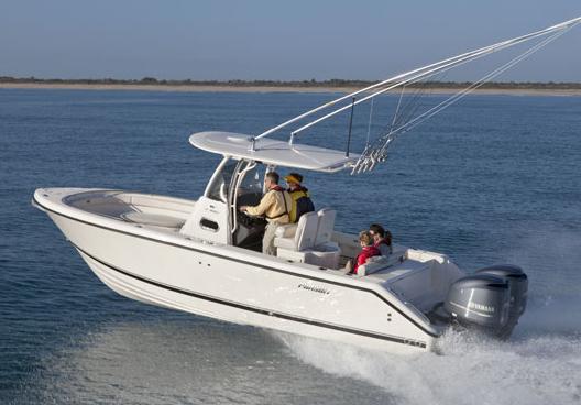 Manufacturer Provided Image: 2013 Pursuit C 260 Center Console boat cruising on the water.