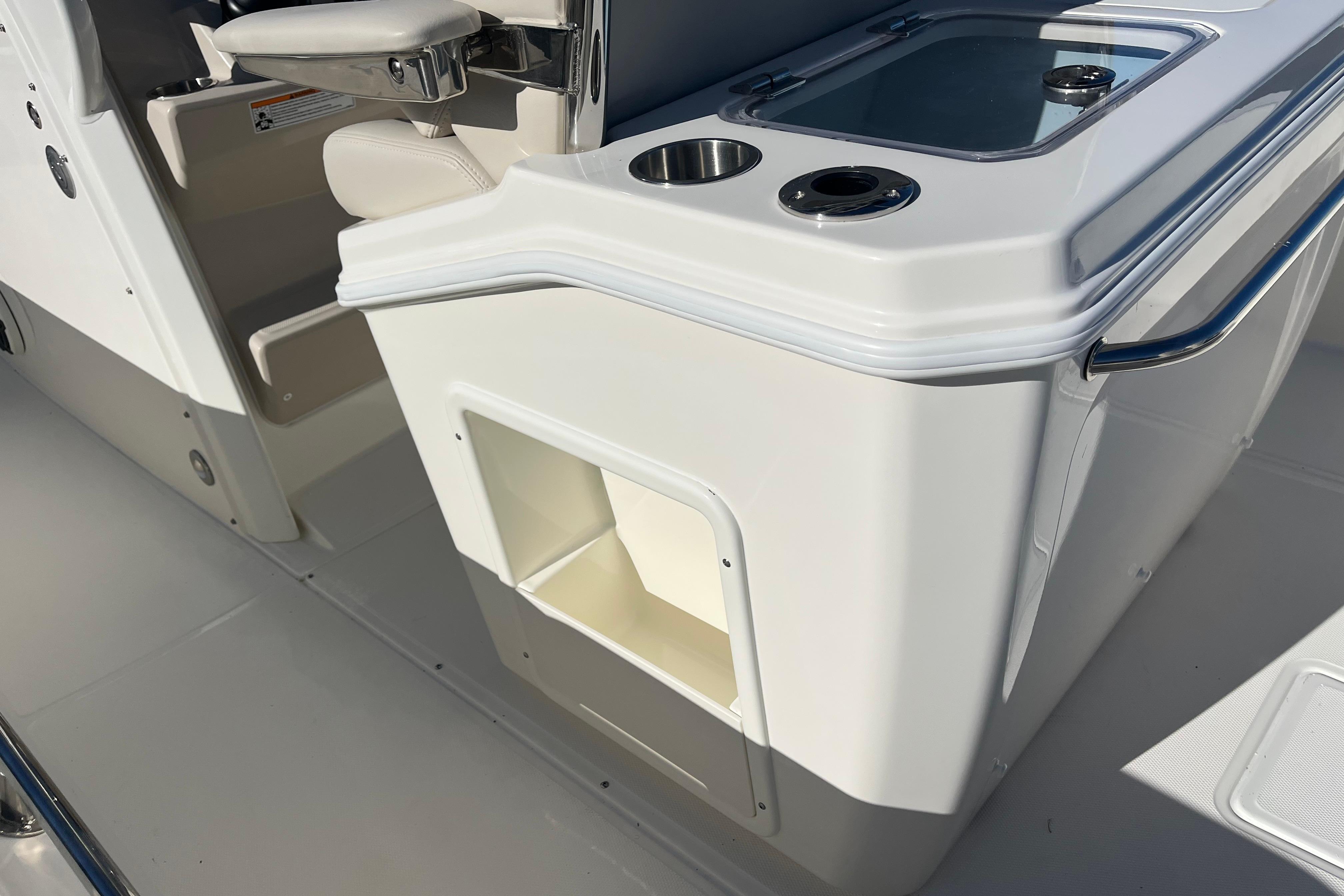 2026 Boston Whaler 280 Dauntless boat interior, featuring seating and storage compartments.
