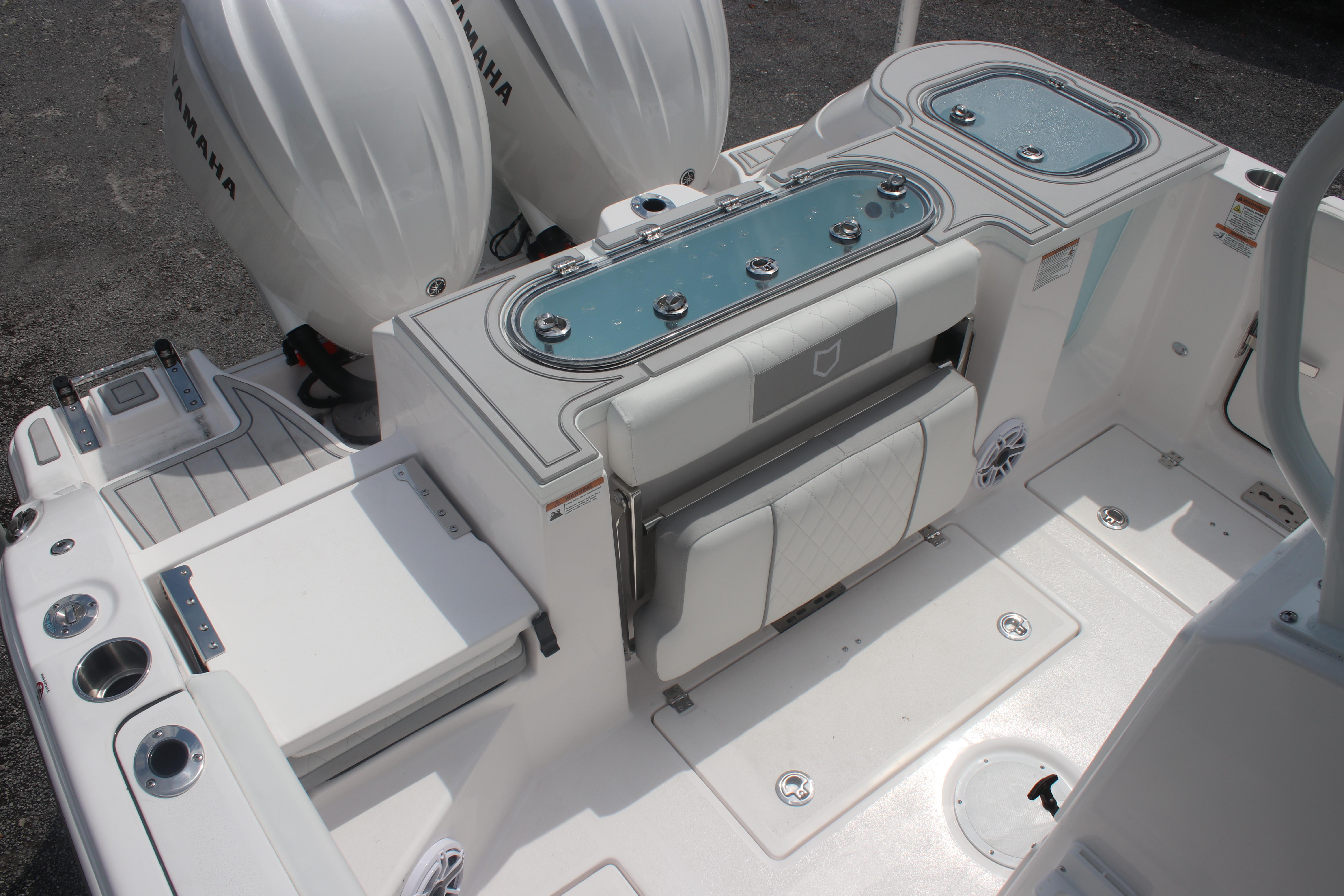 2026 Sea Fox 288 Commander boat interior with Yamaha engines and seating area.