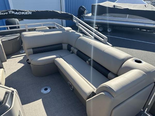 2025 Sun Tracker FB 20 DLX pontoon boat with beige seating and spacious deck.