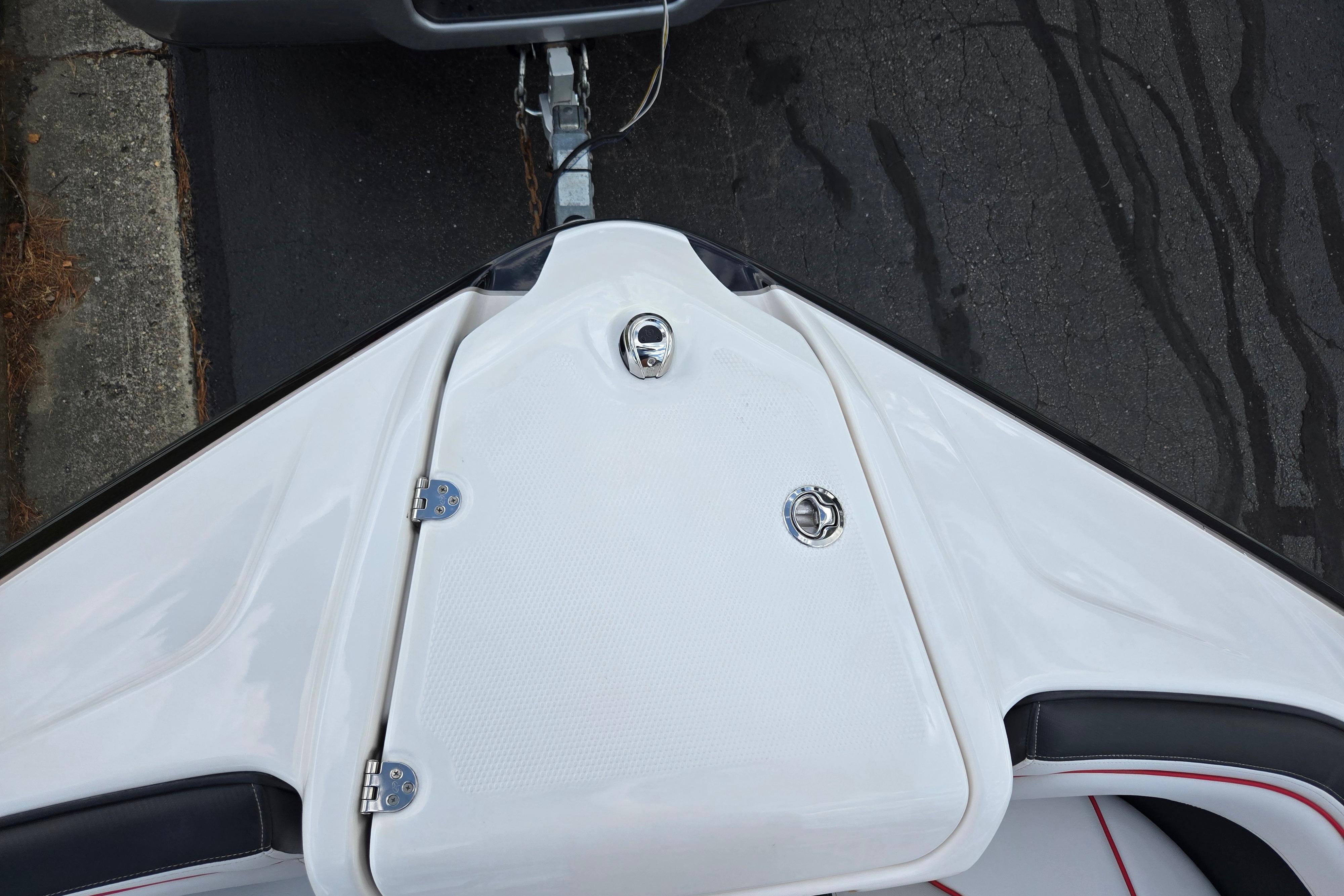 2018 Yamaha Boats 212X bow with closed storage compartment on trailer.