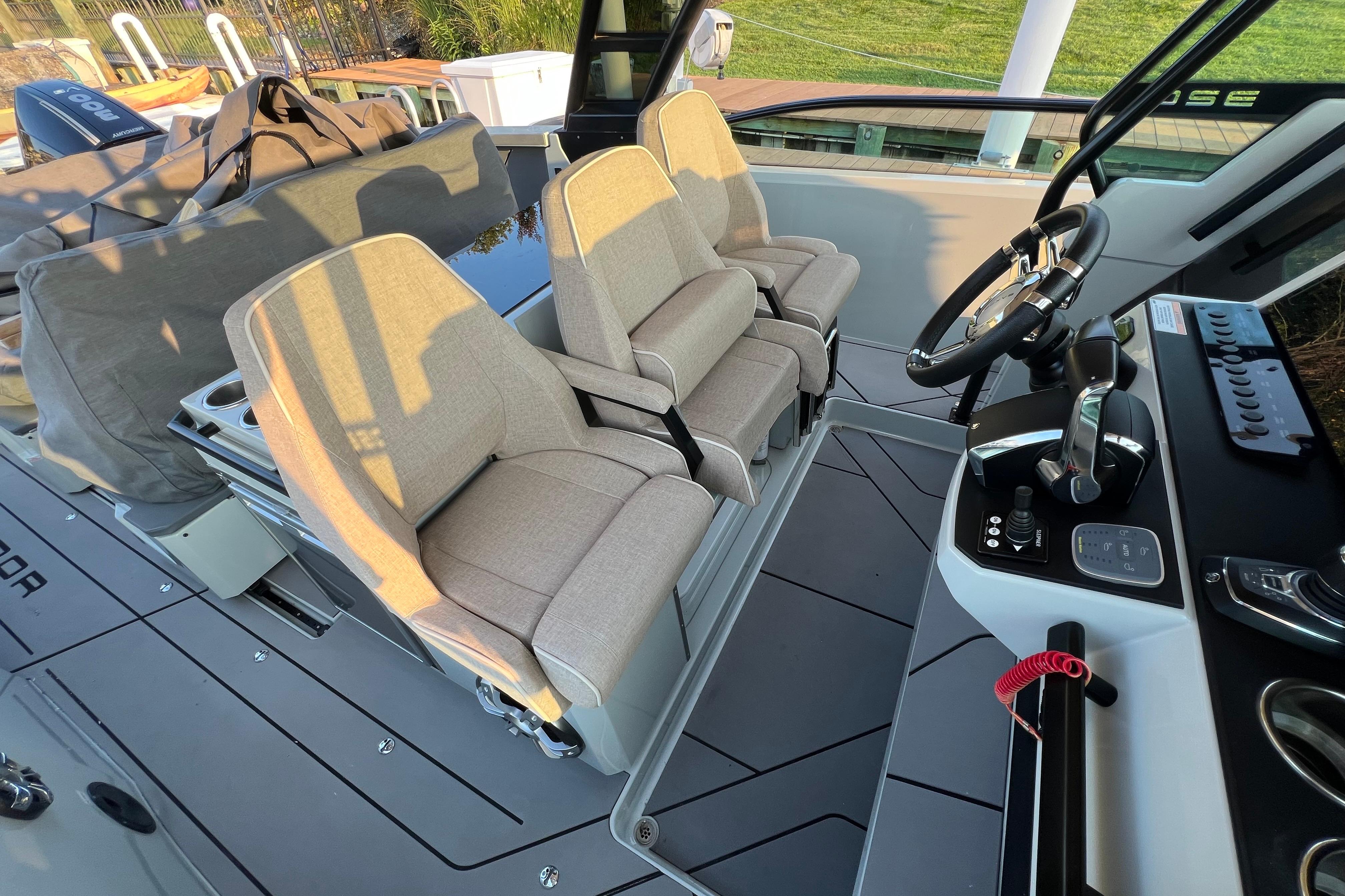 Interior of 2023 Saxdor 320 GTO boat with modern seating and control panel.
