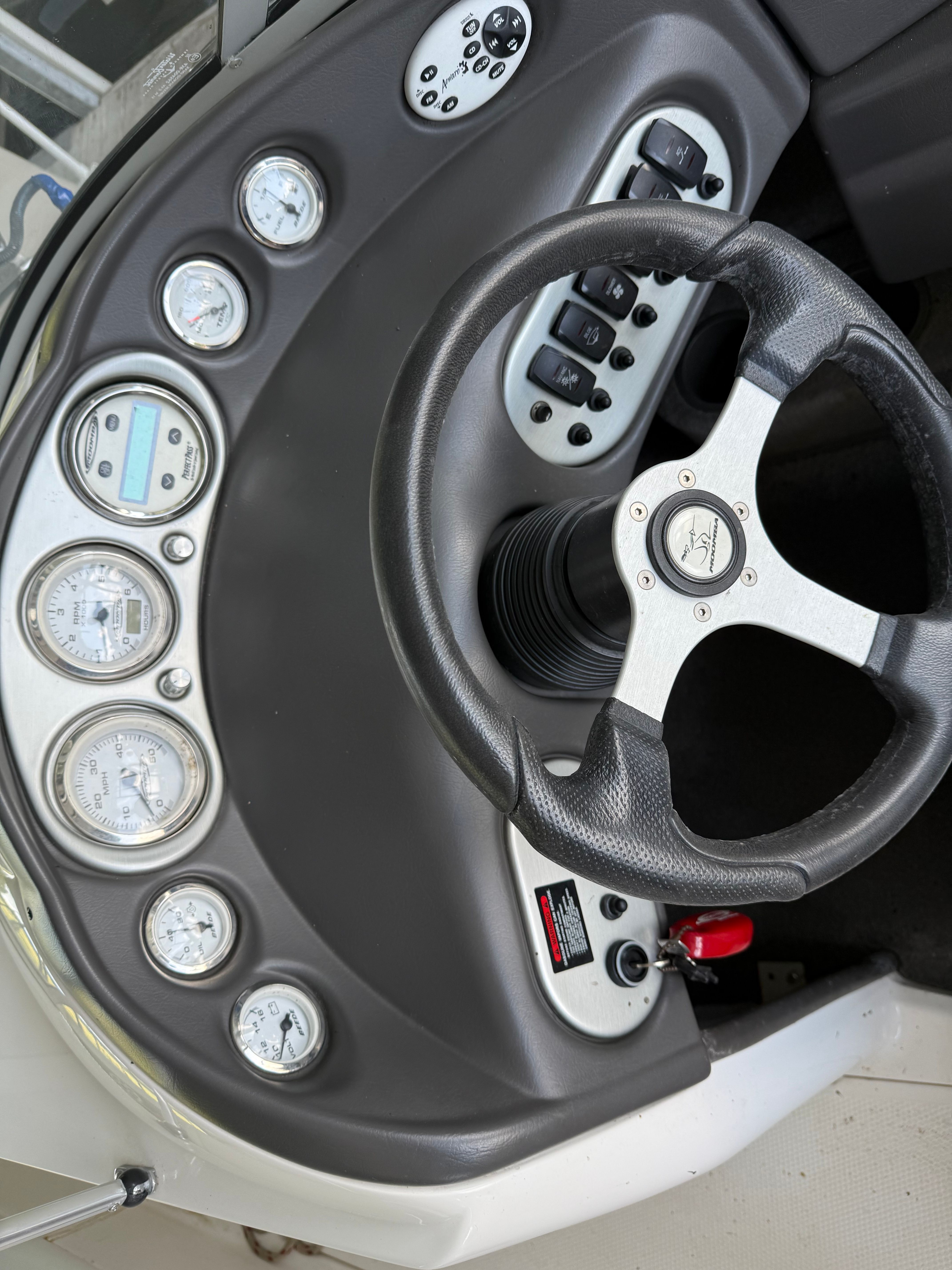 The image shows the dashboard of a 2005 Moomba Mobius LS with multiple gauges and a steering wheel.