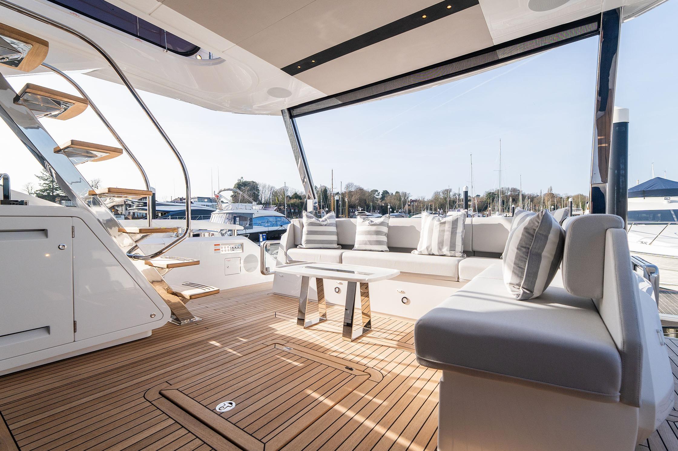 Luxurious 2026 Sunseeker Manhattan 68 yacht deck with elegant seating and wooden flooring.