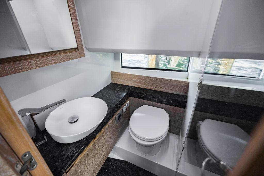 Luxurious bathroom in 2023 Astondoa 377 yacht with modern fixtures and elegant design.