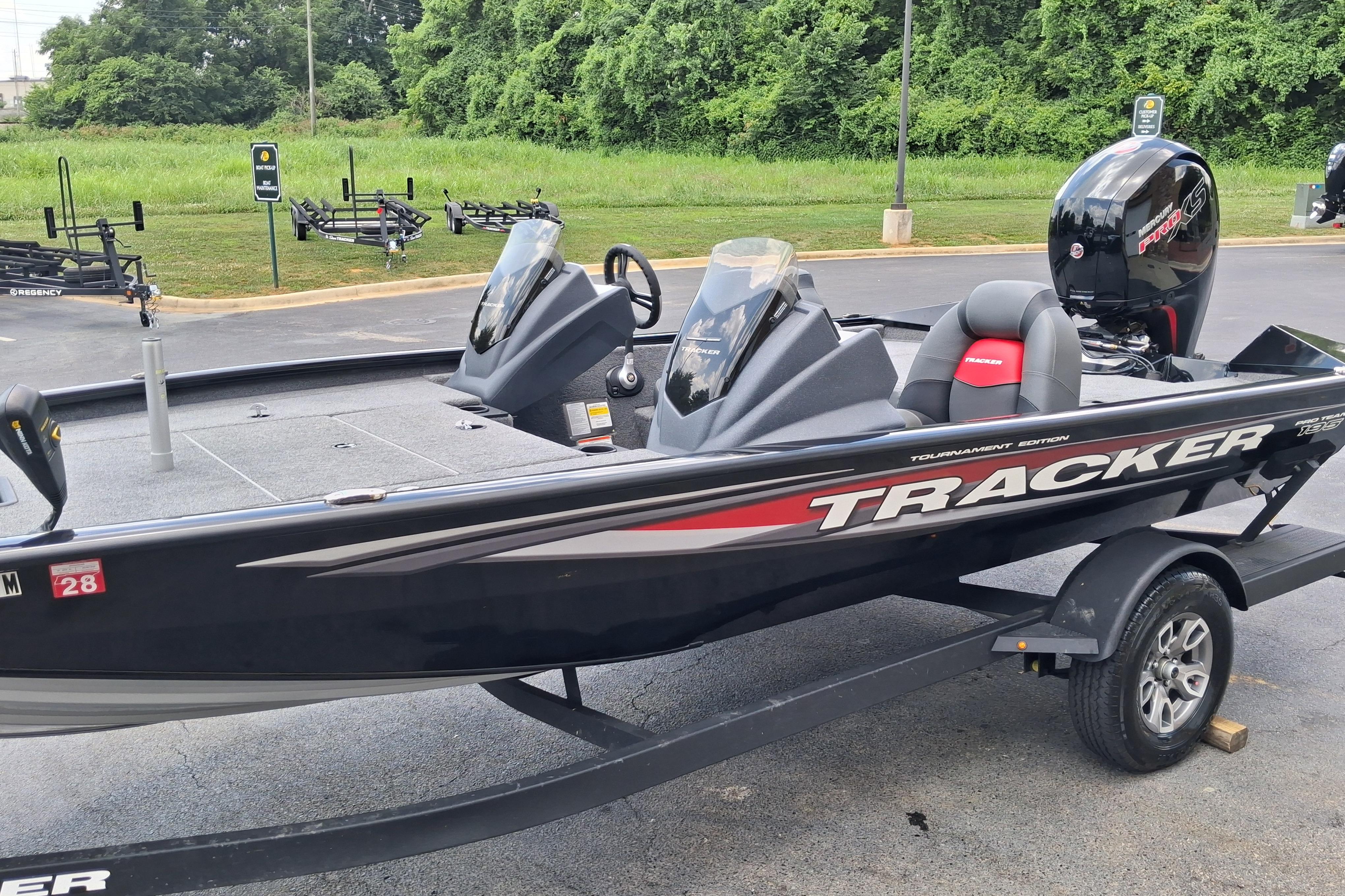 2025 Tracker Pro Team 195 Tournament Edition boat on trailer, parked outdoors.