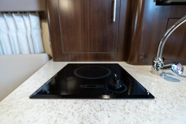 Modern stovetop in 2016 Regal 28 Express yacht kitchen.