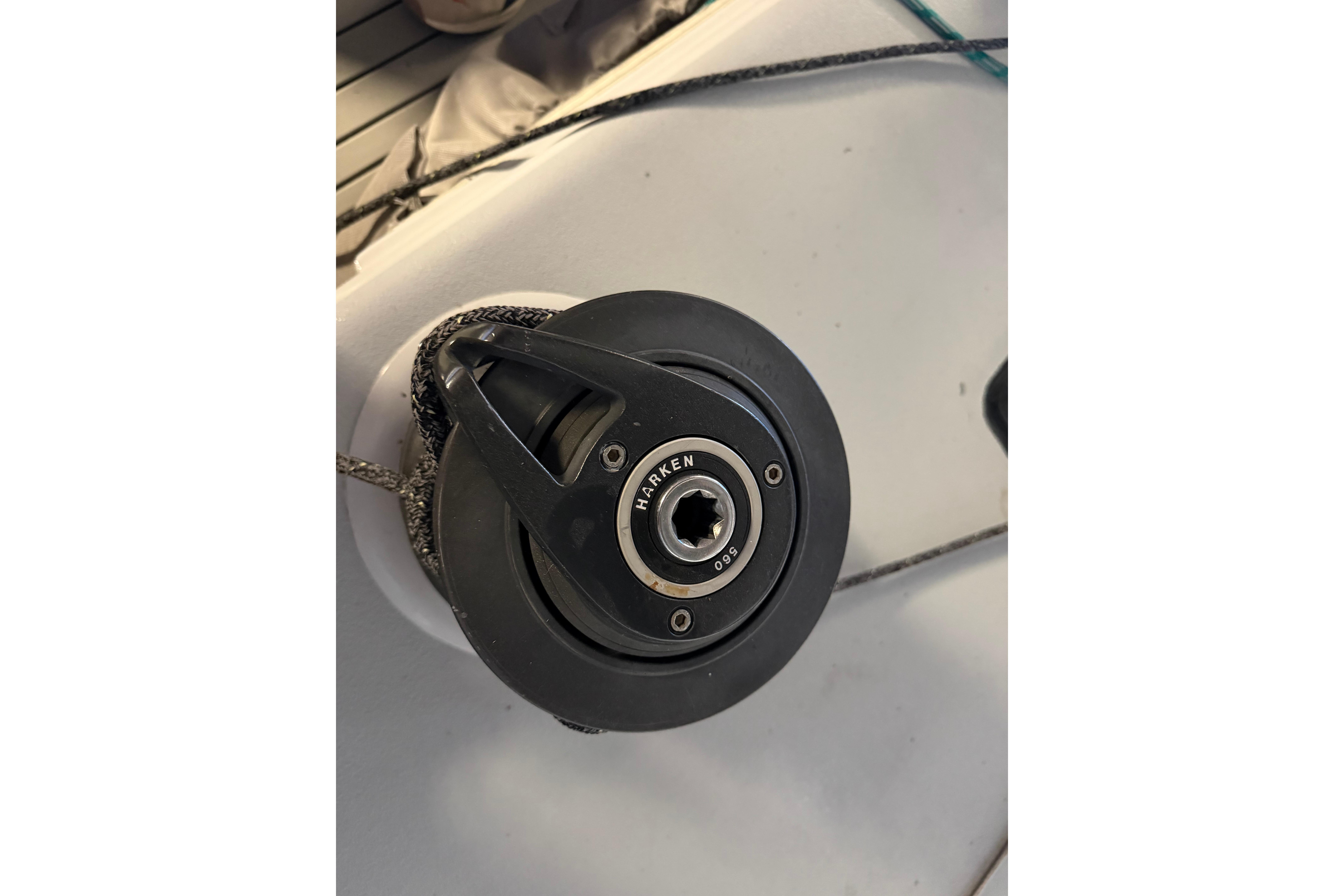 Close-up of a Harken winch on an Andrews 63 sailboat deck.