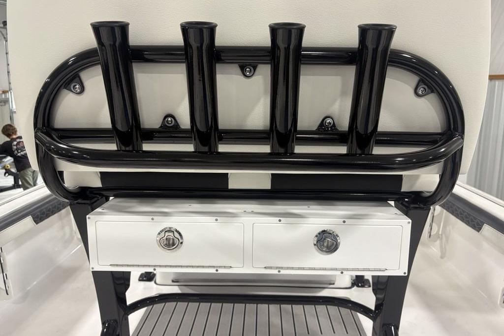 2026 Tidewater 2300 Carolina Bay boat with rod holders and storage drawers.