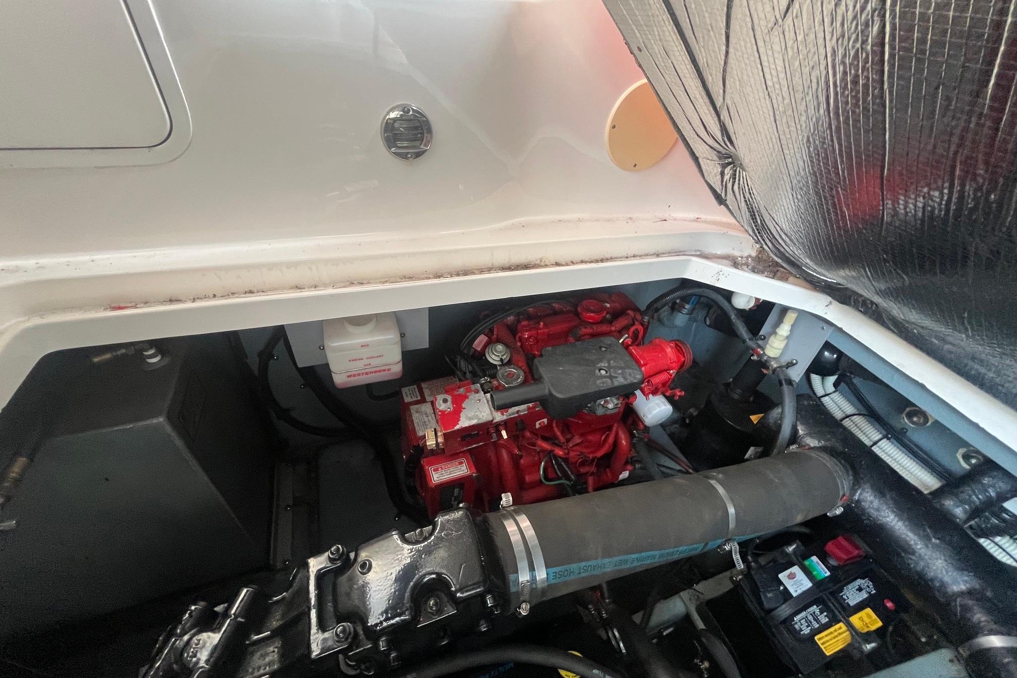 Engine compartment of a 2001 Sea Ray 340 Sundancer boat, showcasing mechanical components.