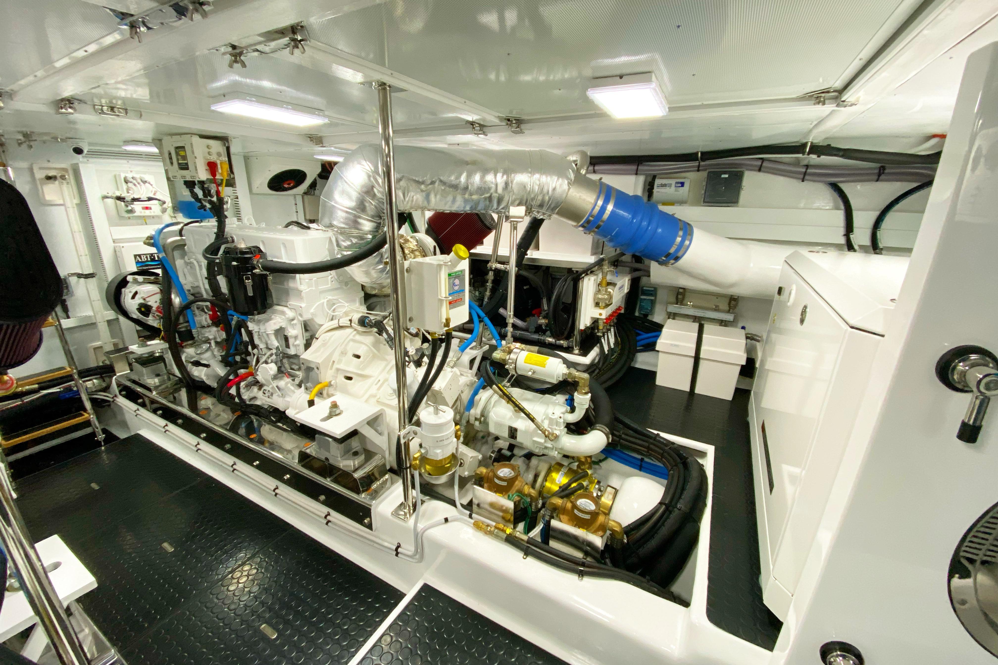 Engine room of 2023 Offshore Yachts 64 ELV, showcasing advanced marine machinery.