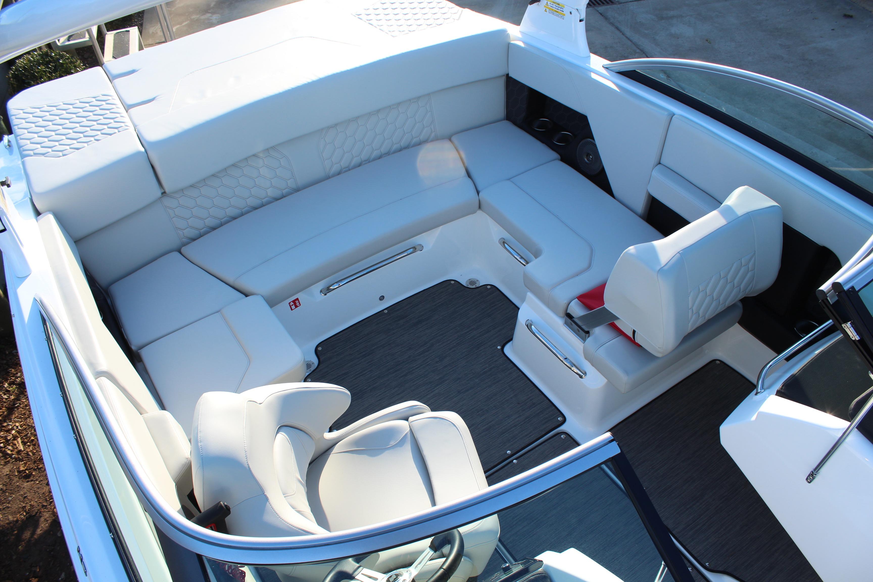 Luxurious interior of 2026 Four Winns H2 Freedom boat with spacious seating.