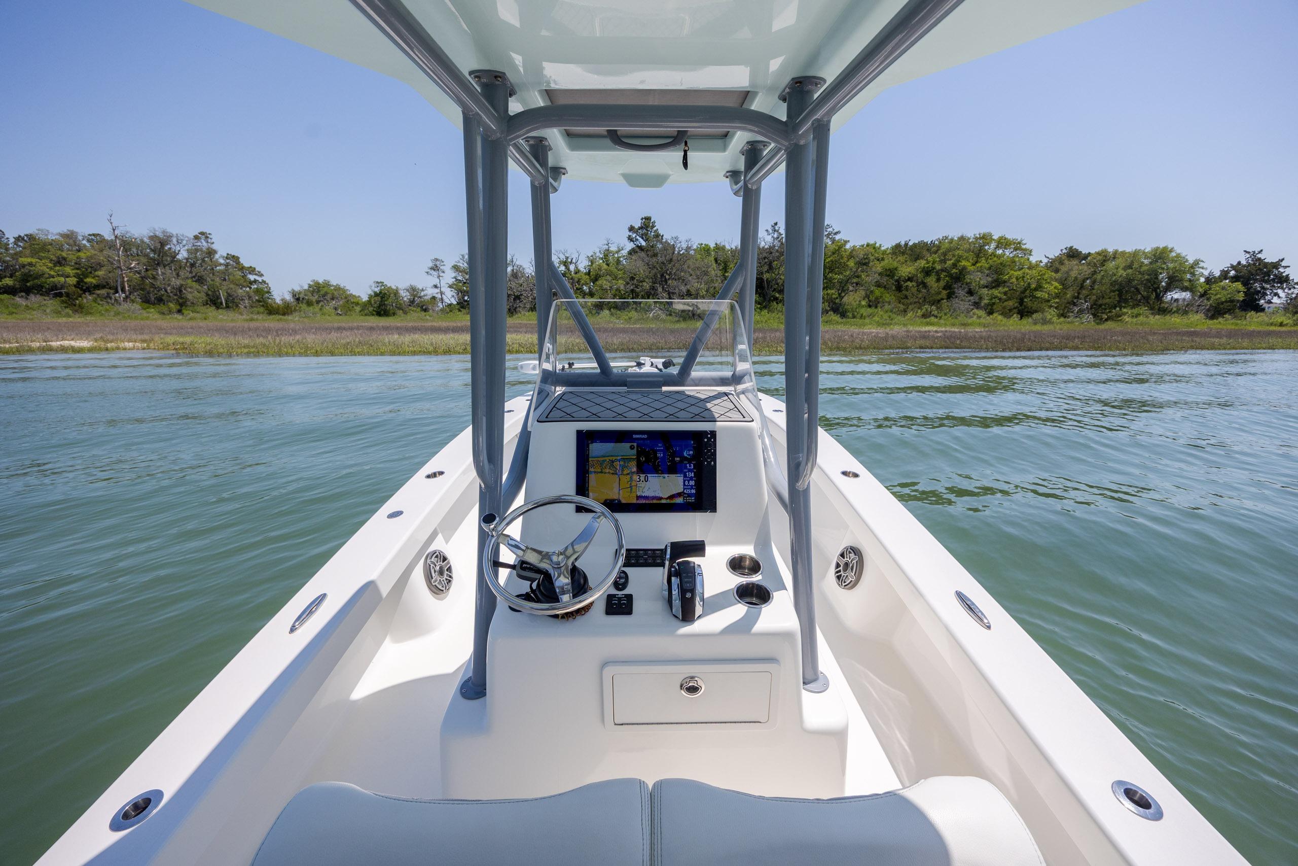 2022 ZCB Freemason 26 boat interior with navigation system on calm water.