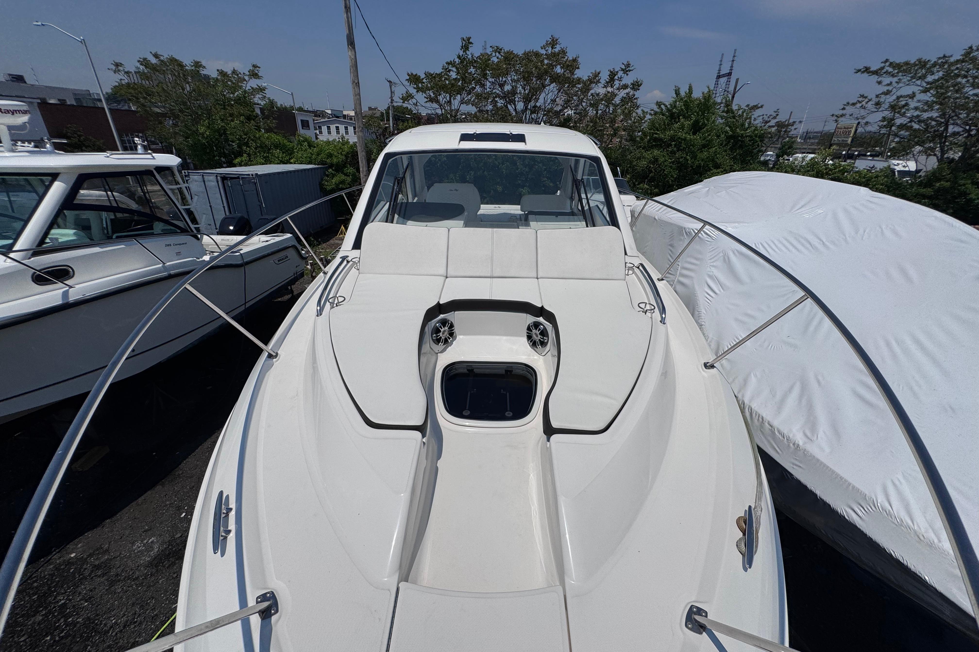 2019 Sea Ray Sundancer 350 boat docked, showcasing sleek design and spacious deck.