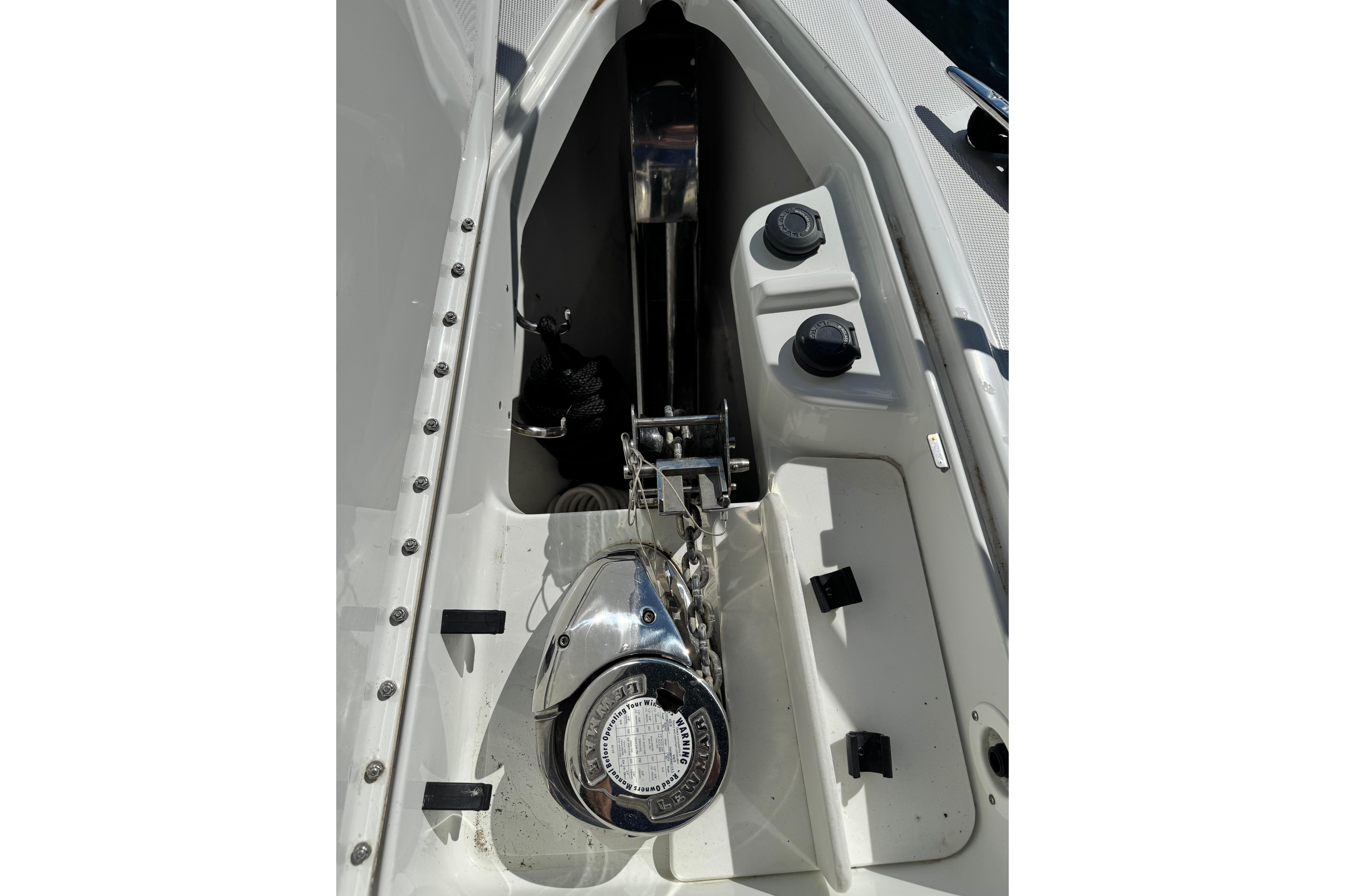 Anchor compartment of a 2008 Formula 400 Super Sport boat, featuring a winch and chain.