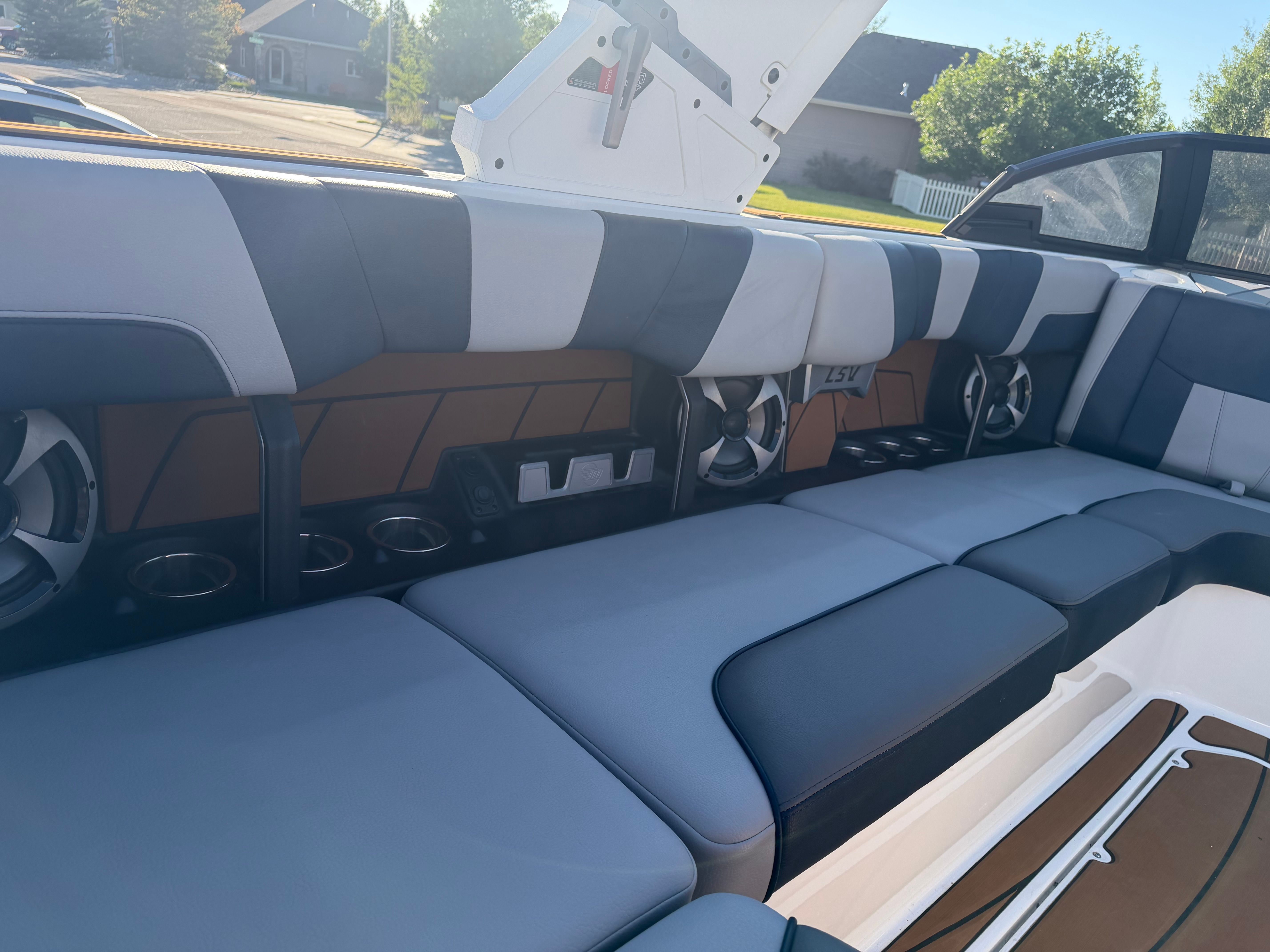 The image shows the interior of a 2021 Malibu Wakesetter 23 LSV with blue and gray seating.