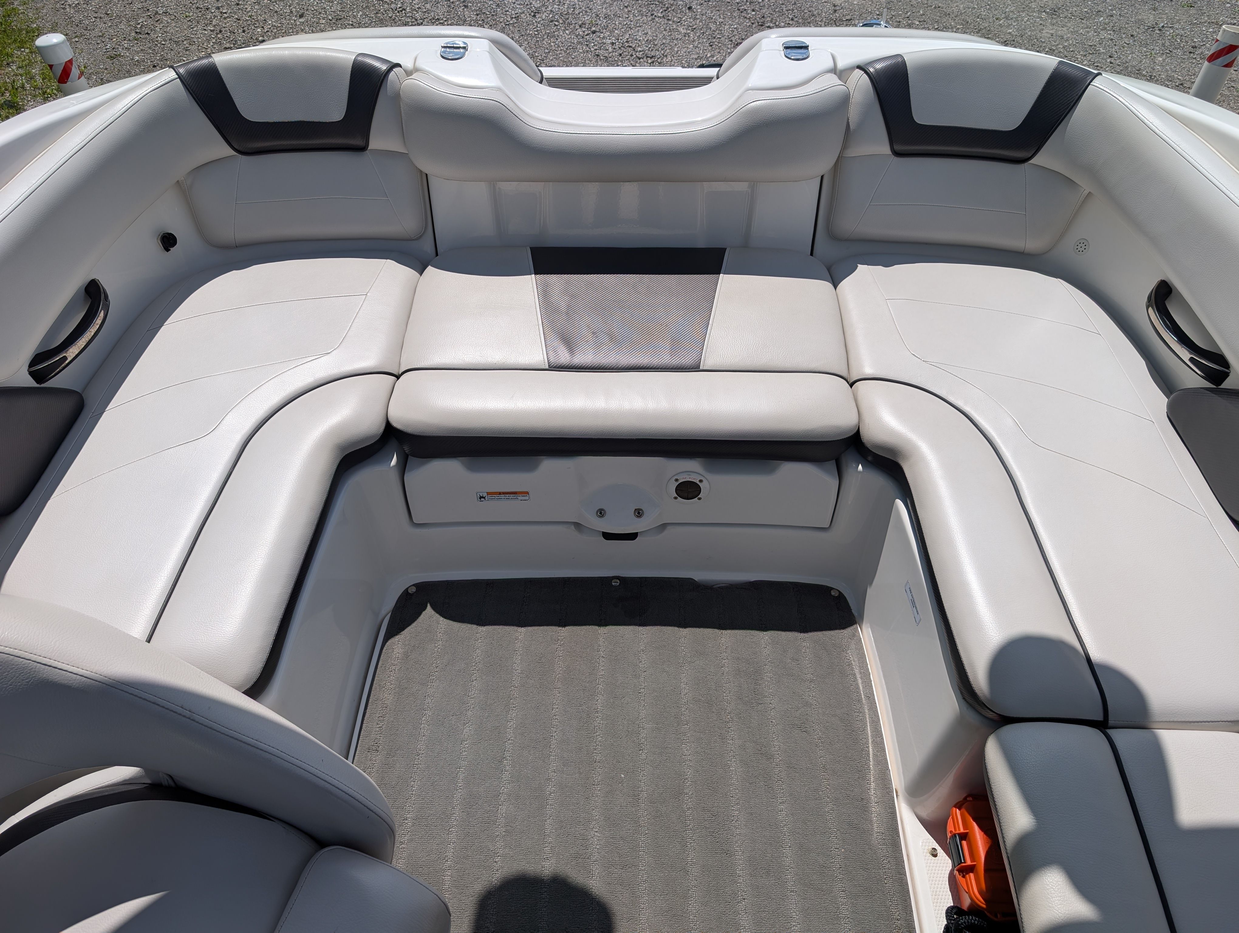 The image shows the seating area of a 2014 Yamaha AR192 boat with white upholstery.