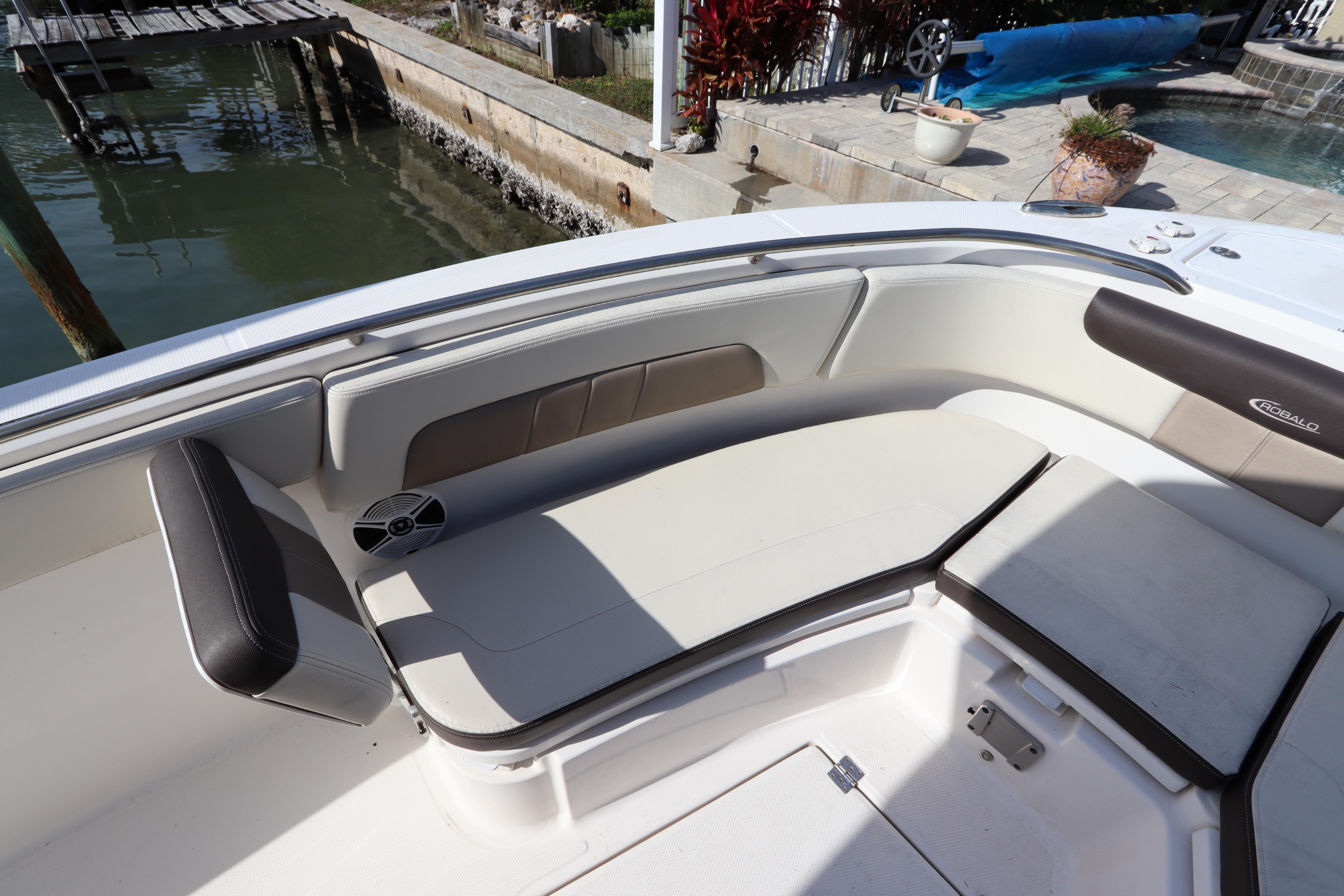 2019 Robalo R242 Center Console boat interior with cushioned seating and speaker.