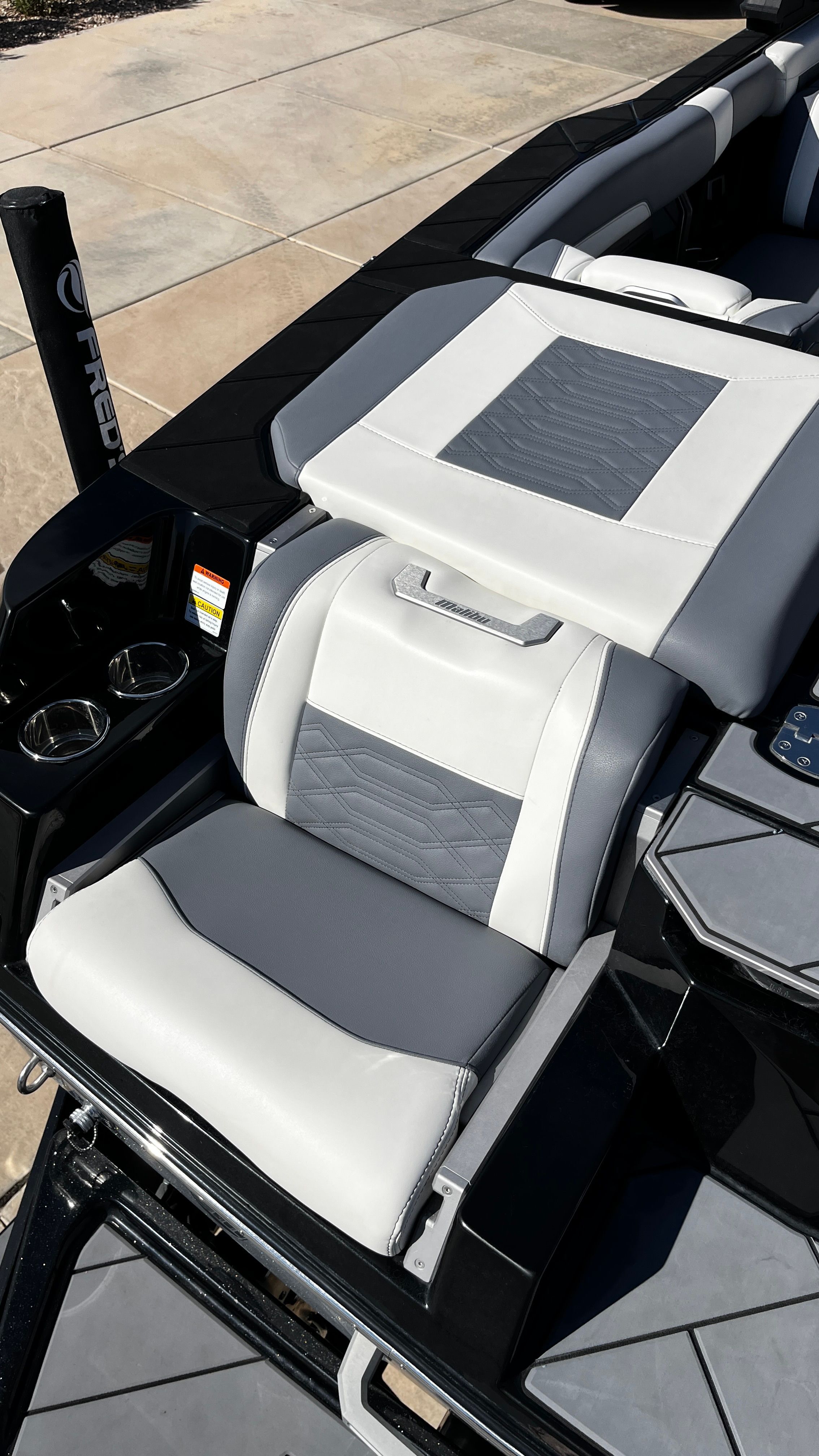 The 2023 Malibu Wakesetter 26 LSV features gray and white seating.