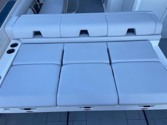 2022 Aviara AV 32-OB boat seating, featuring luxurious white cushions and cup holders.