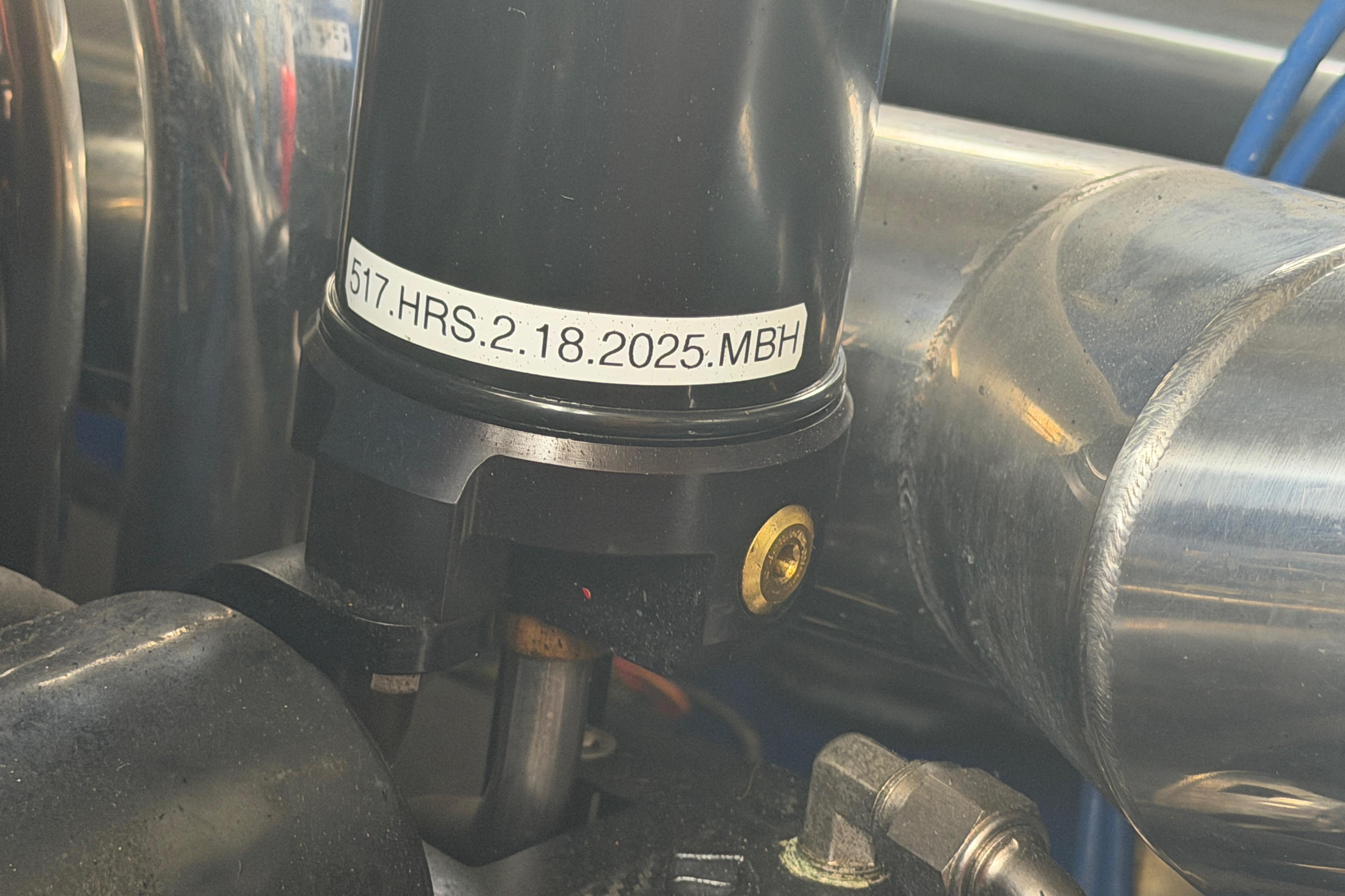Close-up of a 2013 Nor-Tech 477 SPX Vee Bottom engine component with label details.
