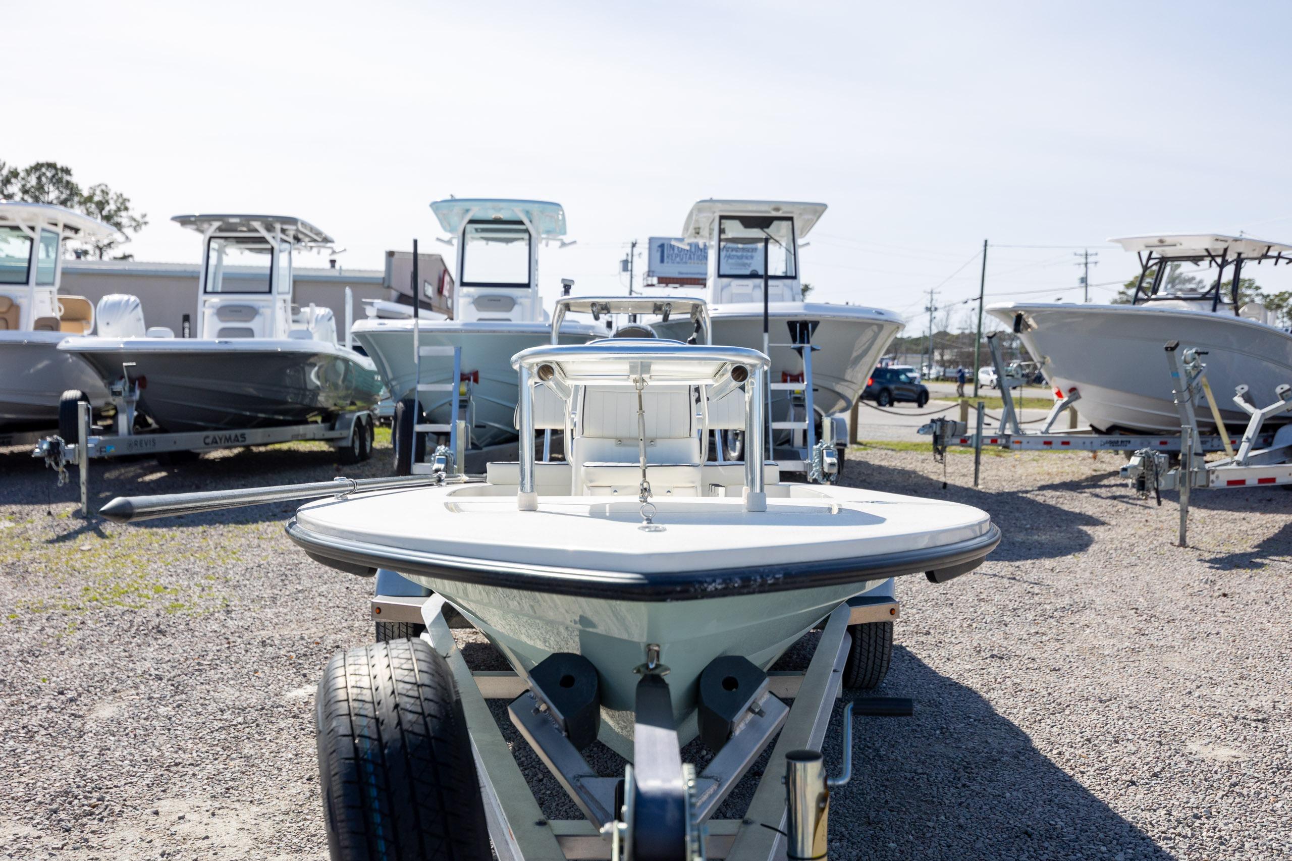 2024 Maverick 17 HPX-S boat on trailer, surrounded by other boats in a dealership lot.