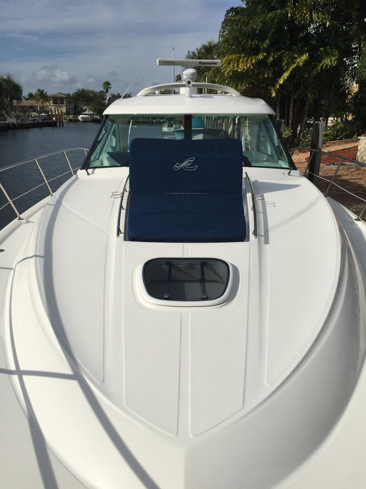 2010 Sea Ray 450 yacht on calm waters.