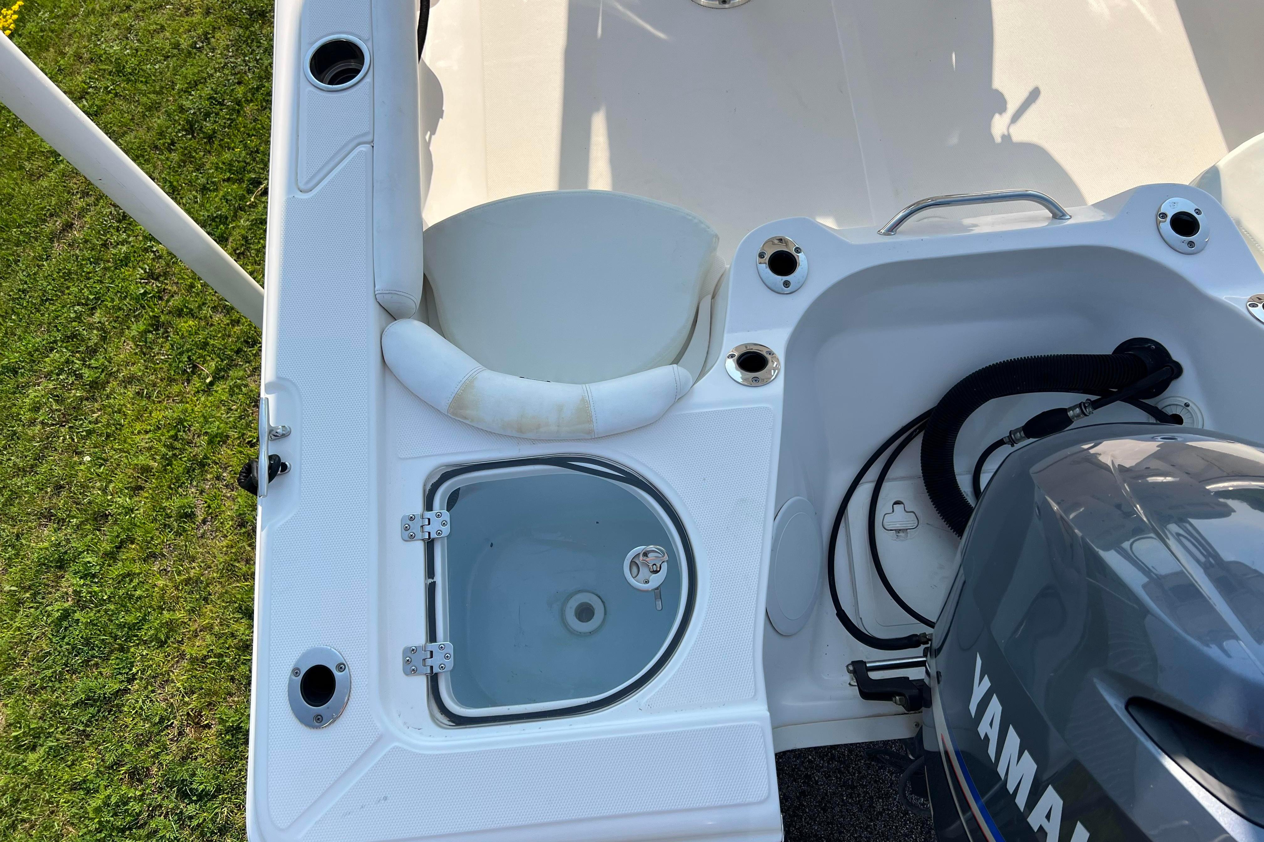 2012 Sea Fox 206 Center Console boat with Yamaha engine, featuring a livewell and rod holders.