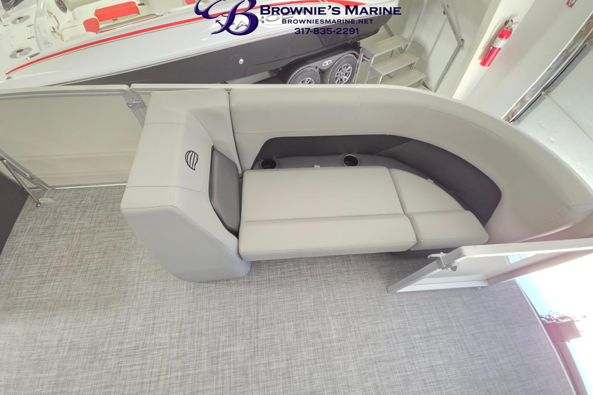 2026 Sun Tracker Party Barge 18 DLX interior seating with gray upholstery and cup holders.