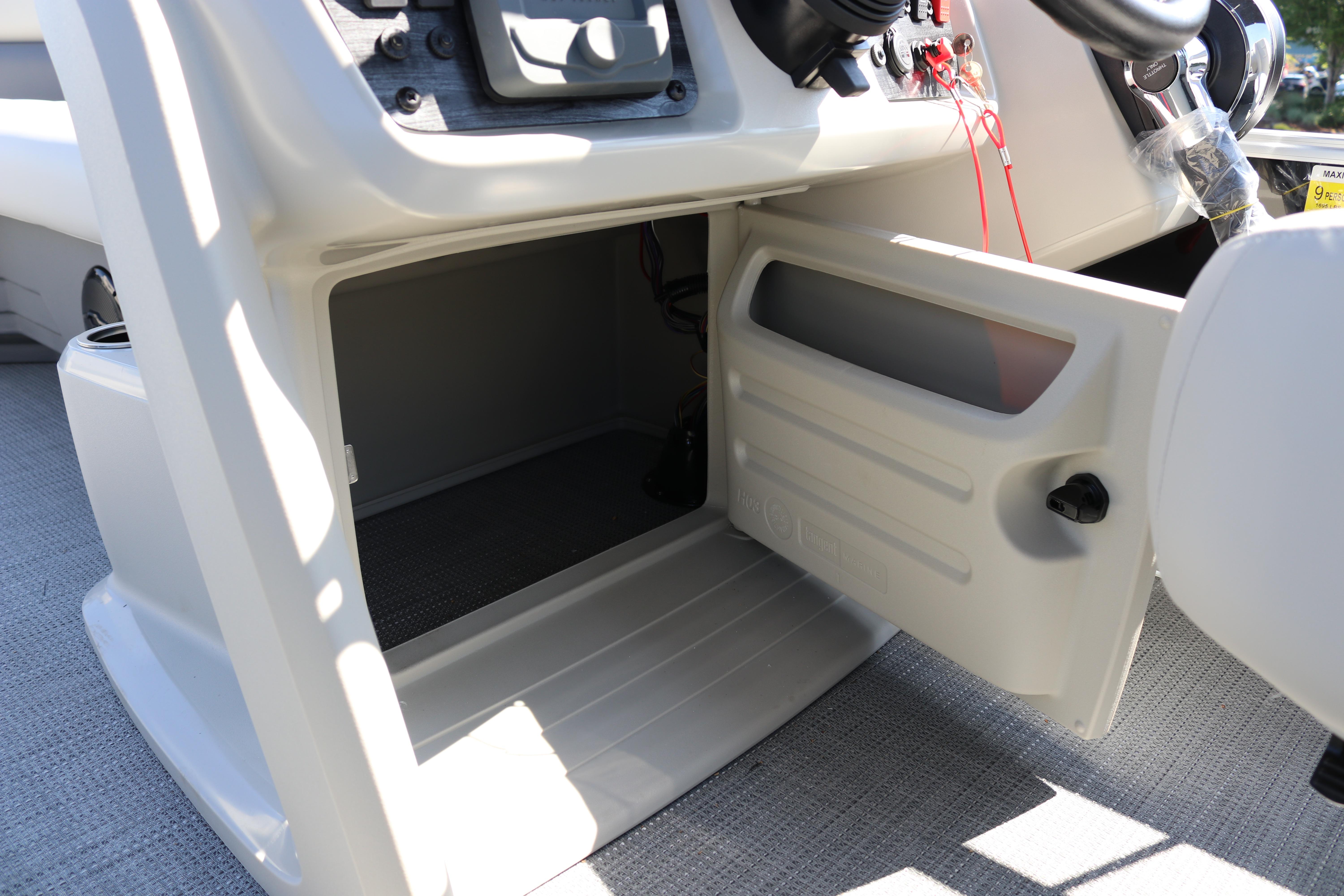 Open storage compartment on 2025 SunChaser Vista 20 Fish boat console.