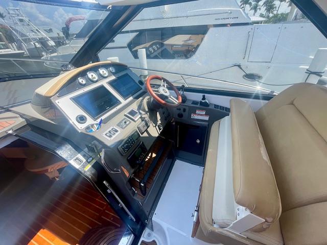 2011 Regal 46 Sport Coupe helm with modern controls and beige seating.